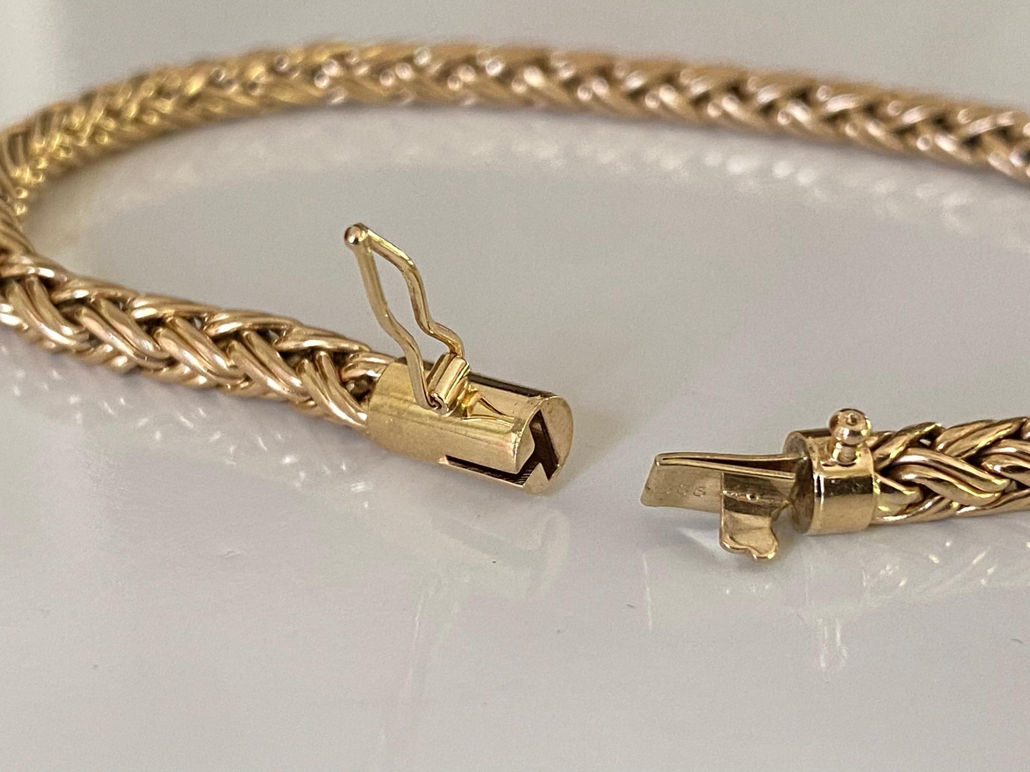 This classic vintage Tiffany & Co rope bracelet crafted in 14kt yellow gold measures 7.3 inches long and approximately 4mm thick. Stamped Tiffany & Co
