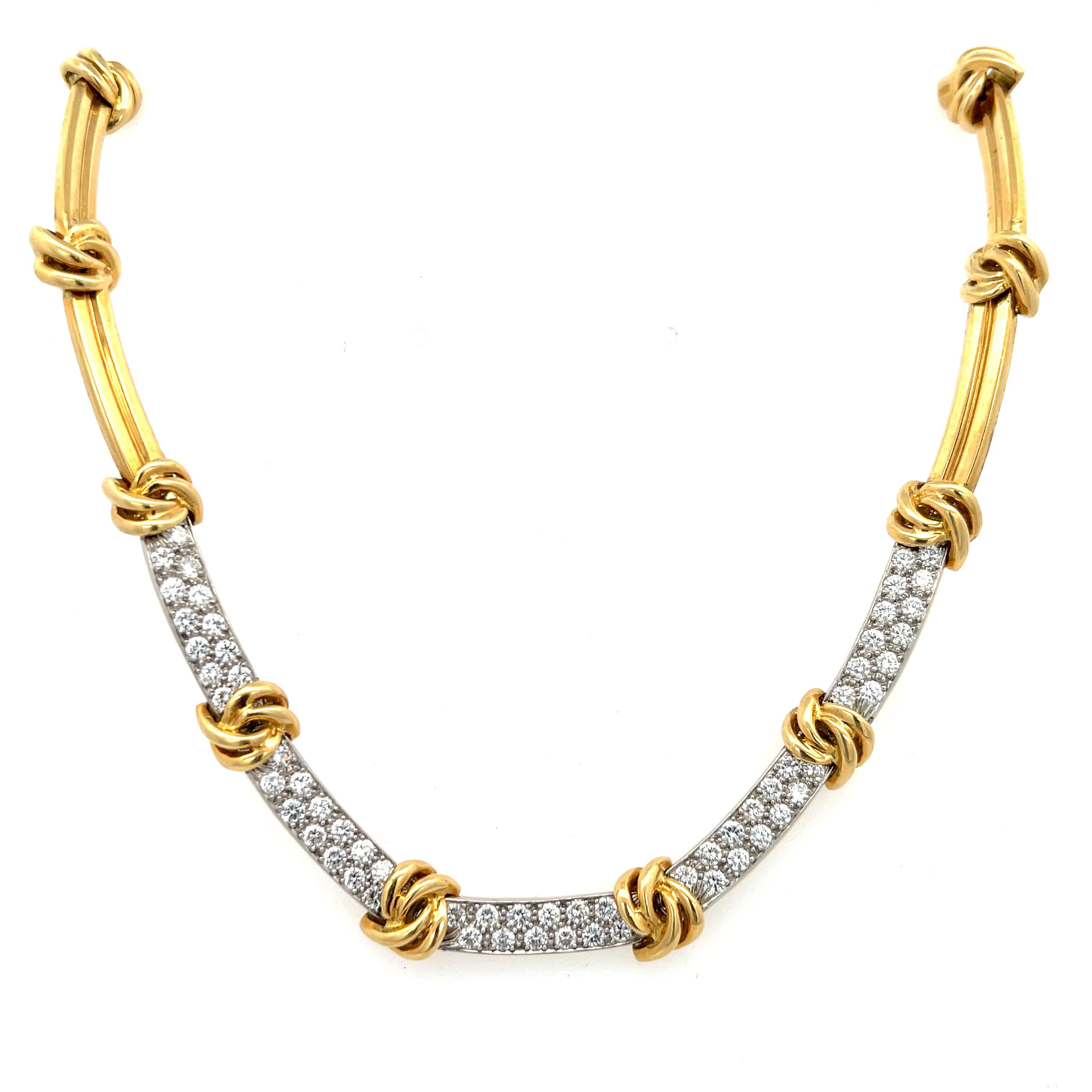 Estate Tiffany & Co. Knot Diamond Station Necklace in 18K Yellow Gold. The necklace features 3.90ctw of brilliant round diamonds. Then necklace is 15.5