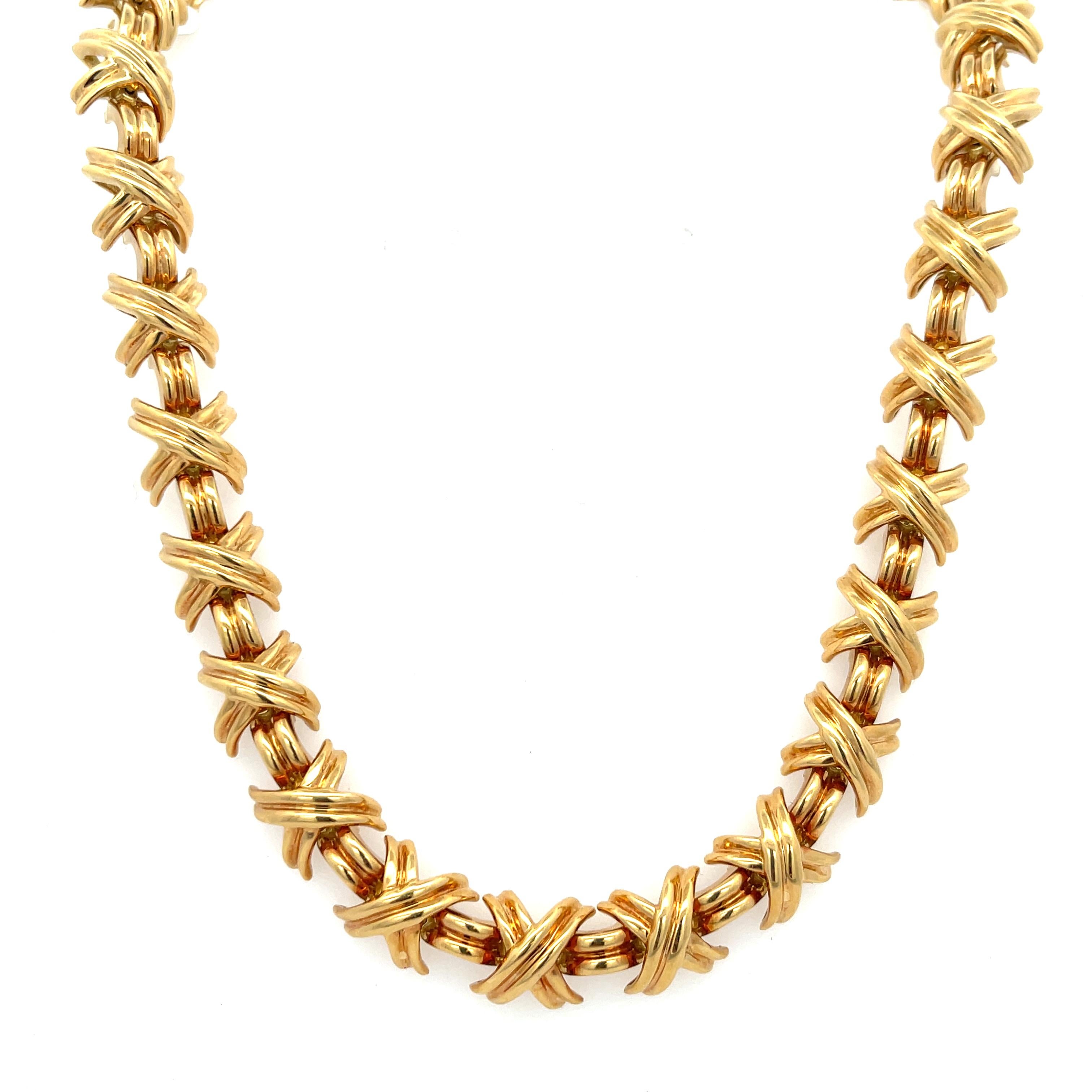 Estate Tiffany & Co. Large X Signature Collection Necklace in 18K Yellow Gold. The necklace is 16.5 inches long, 3/8 inch wide, and weighs 86.5 grams. Features an hidden clasp with safety latch. Singed T&CO 750.