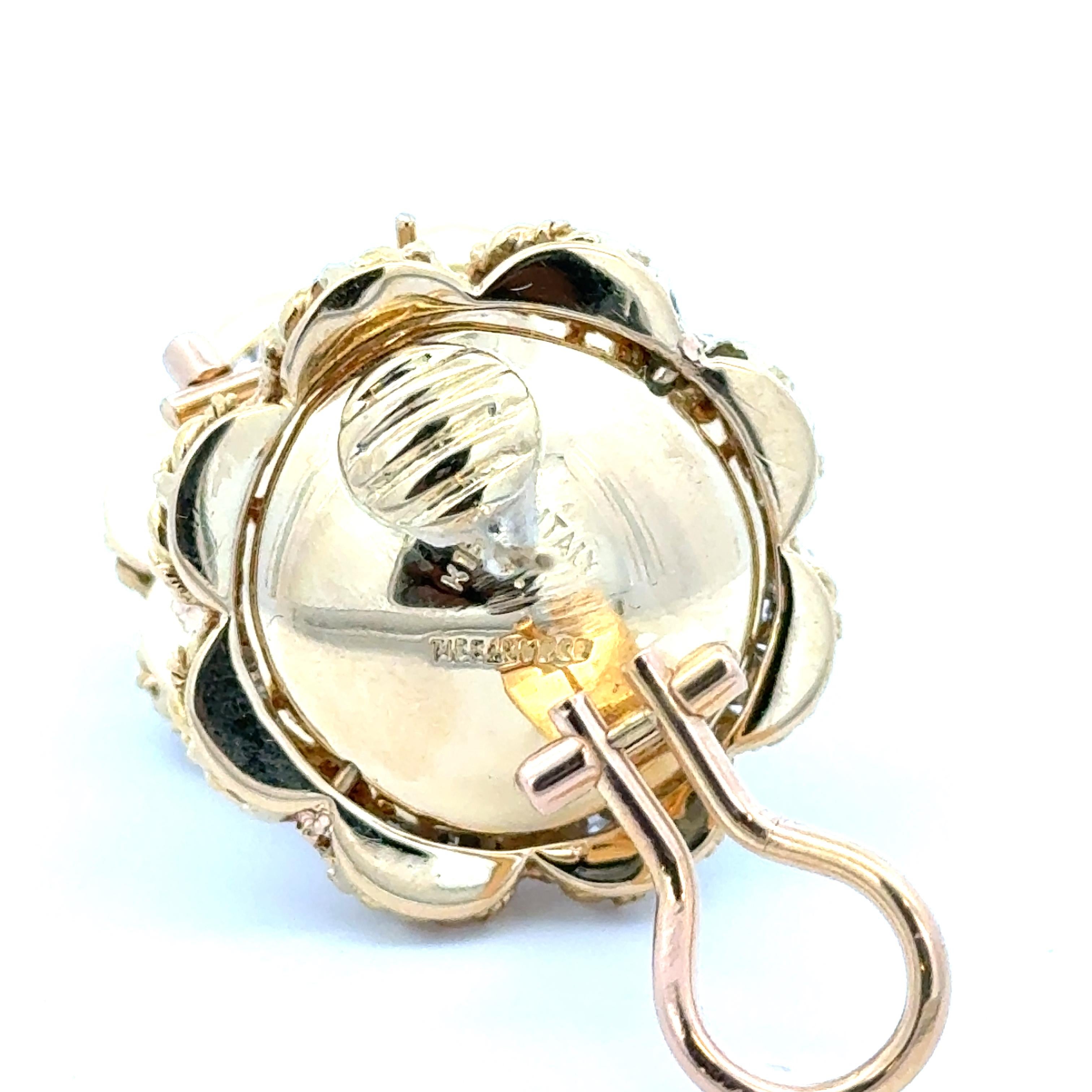 Estate Tiffany & Co. Mabe Pearl Diamond Earrings in 18K Yellow Gold.  The earrings are stamped TIFFANY&CO K18 ITALY. They have an approximate diameter of 0.92 inches and weigh 19.3 grams. 