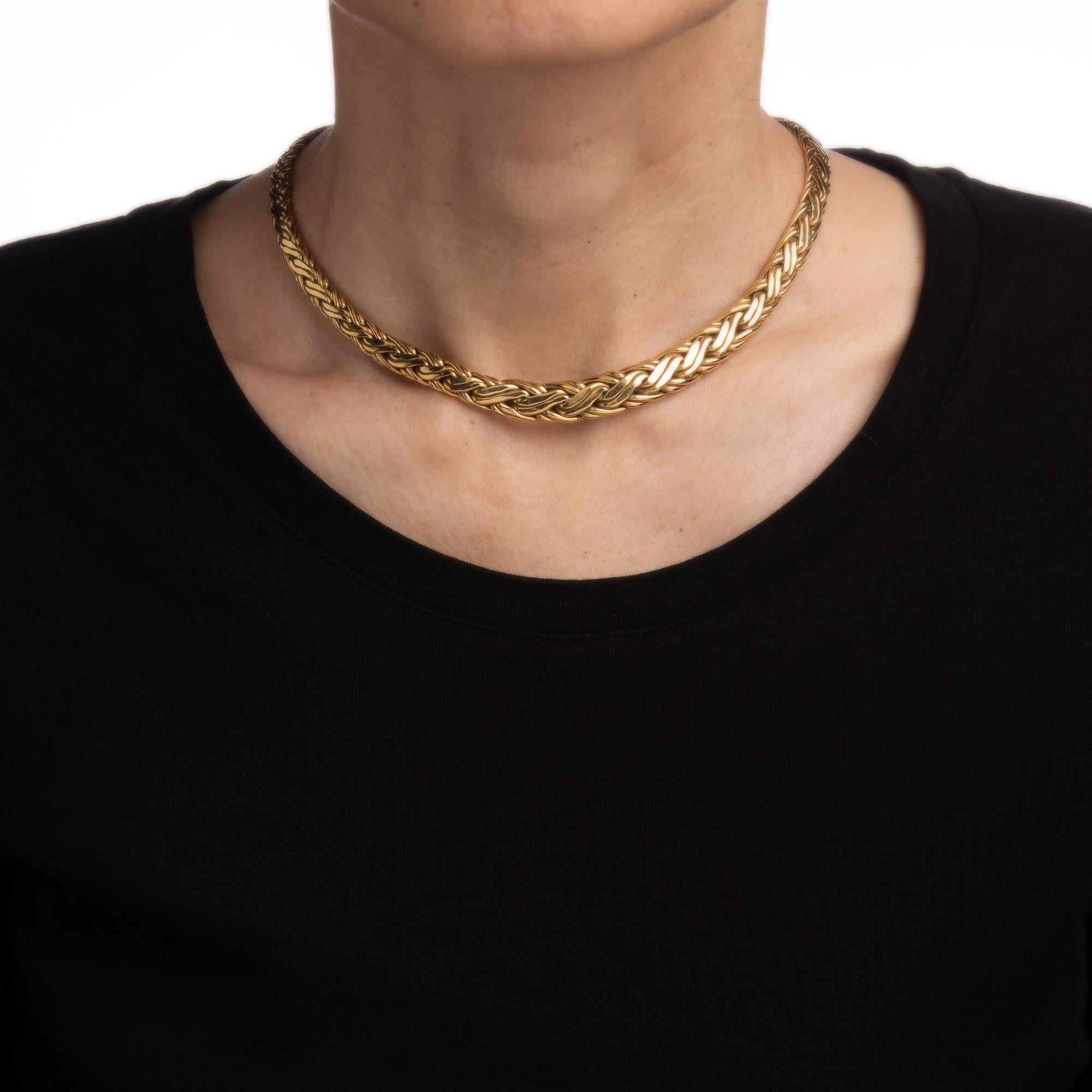 Stylish and finely detailed pre-owned Tiffany & Co choker necklace, crafted in 18k yellow.  

The necklace features an interwoven fancy link weave pattern that graduates from 5mm to 9.5mm wide. Measuring 15 inches in length the necklace sits nicely