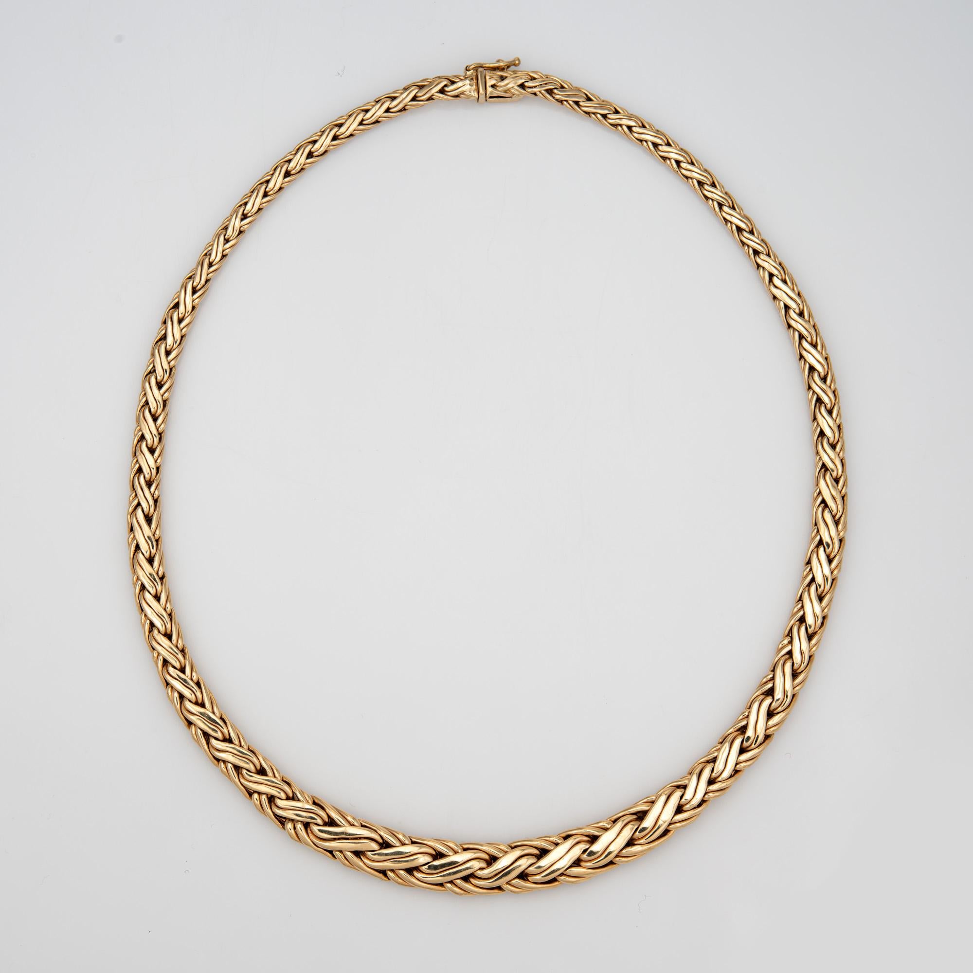 Stylish and finely detailed pre-owned Tiffany & Co choker necklace, crafted in 14k yellow.  

The necklace features an interwoven fancy link weave pattern that graduates from 4.5mm to 9mm wide. Measuring 16 inches in length the necklace sits nicely