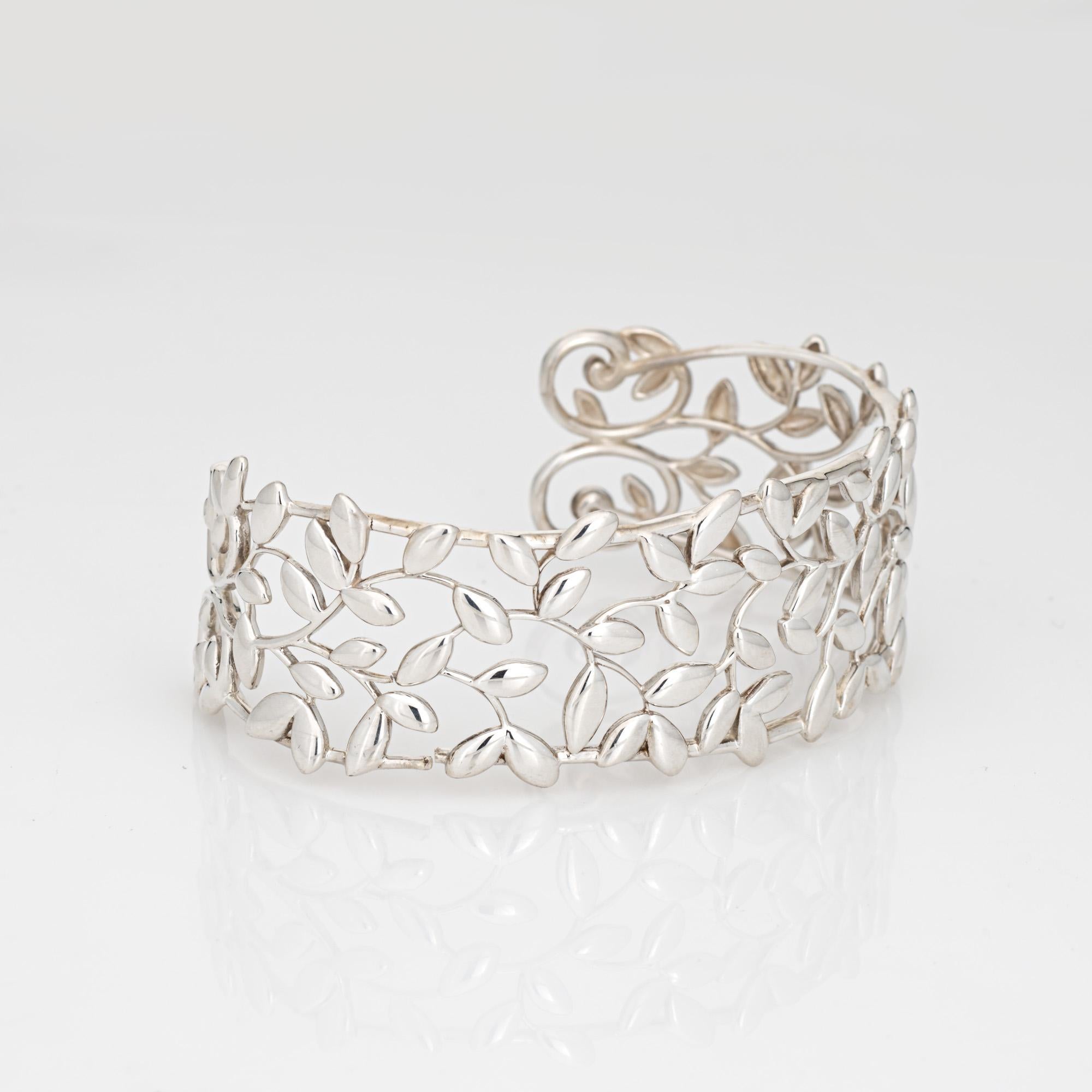 Estate Tiffany & Co Olive Leaf cuff bracelet crafted in sterling silver.  

The beautifully designed cuff was inspired by the olive branch, a symbol of peace and abundance. Larger in size the XL bracelet will fit a wrist up to 7 inches. Great worn
