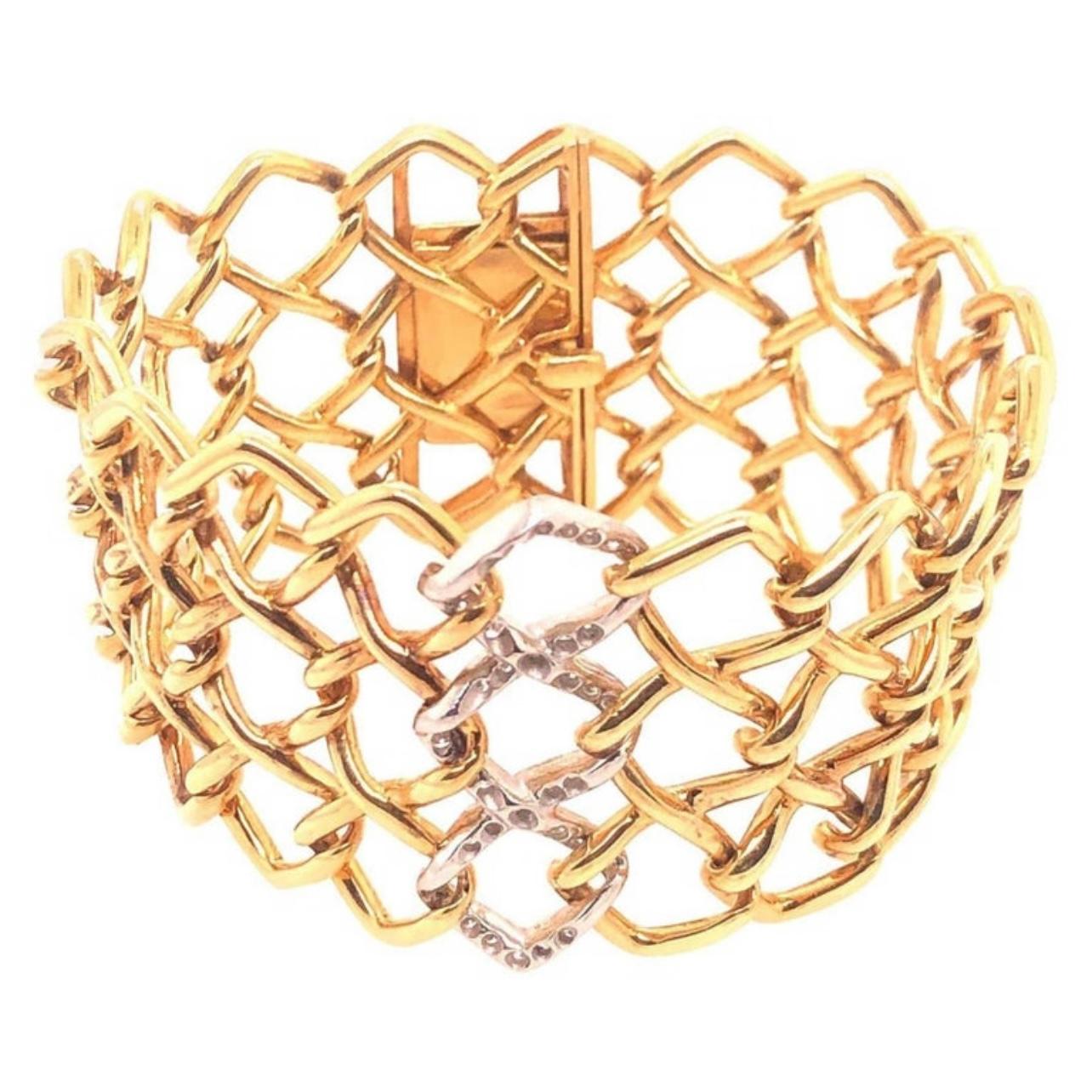 Estate Tiffany & Co. by Paloma Picasso Yellow Gold and Platinum Diamond Bracelet. The bracelet features 0.80ctw of brilliant round cut diamonds. 
7