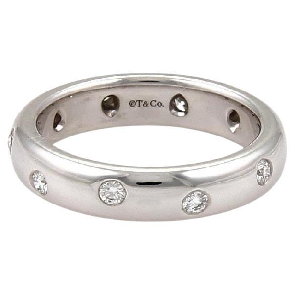 Estate Tiffany& Co Platinum Band with Etoile Set Round Diamonds