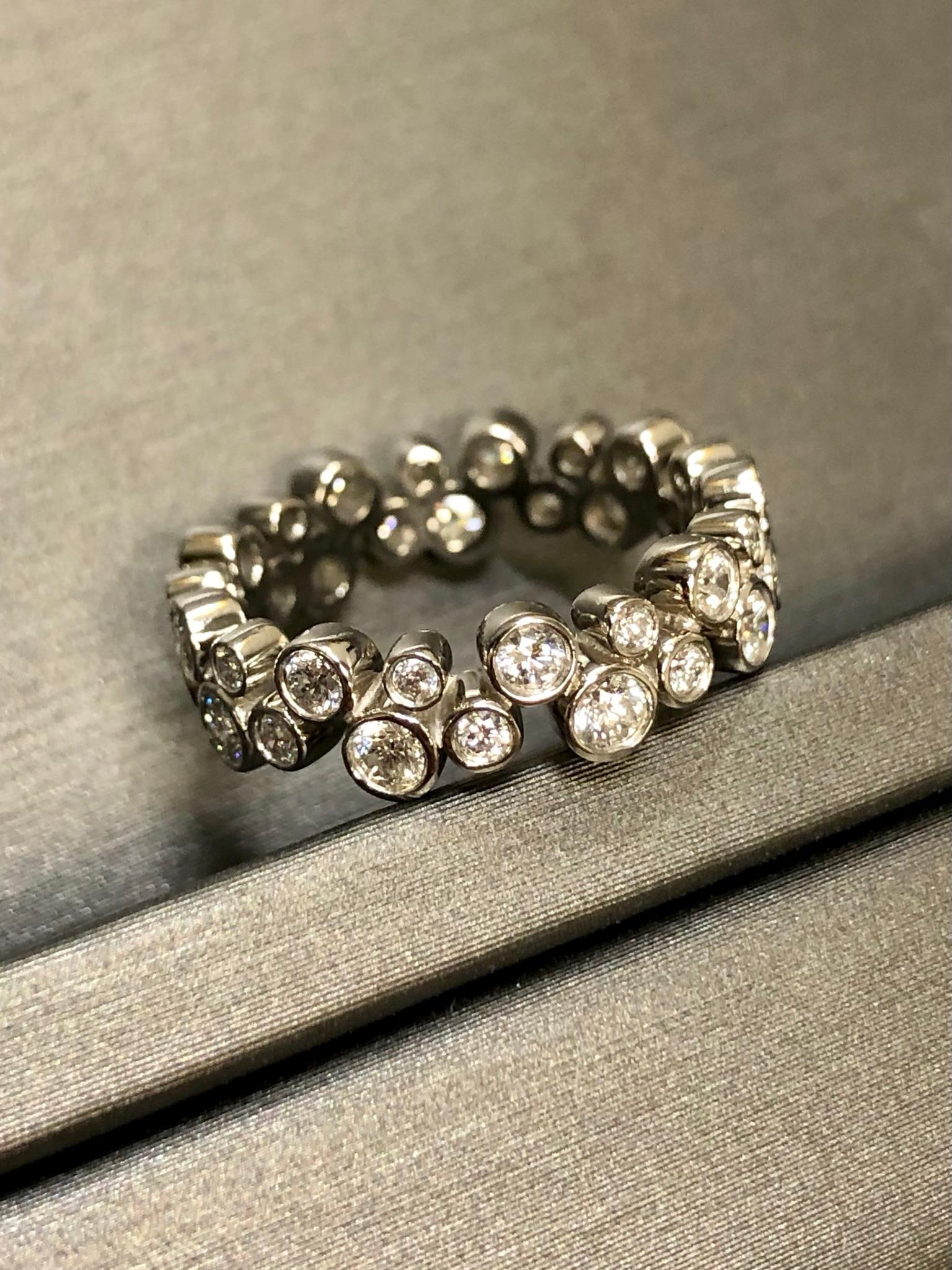 Tiffany & Co. bubbles collection eternity band done in platinum set with approximately .96cttw in diamonds. All stones are original and of Tiffany quality. The inside of the band is stamped “2004 Tiffany & Co PT 950”.


Dimensions/Weight:

Ring is a