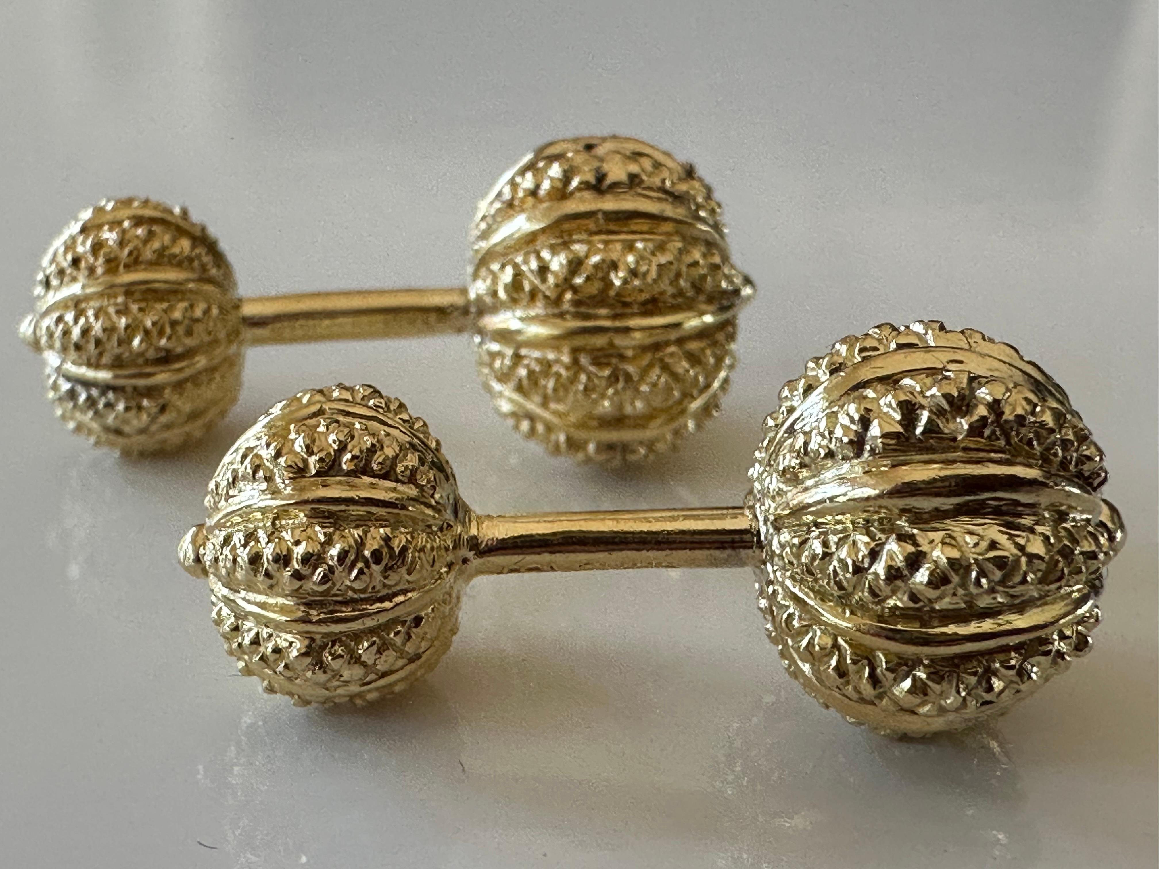 These cufflinks are artfully hand crafted in rich, highly textured 18K yellow gold by legendary designer Jean Schlumberger for Tiffany & Co. They measure 1.25 inches long, 12mm (top ball), 10mm (bottom ball) and are stamped Schlumberger, Tiffany,