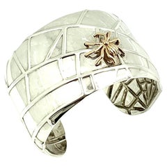Propiedad Tiffany & Co. Brazalete araña de plata de ley y oro amarillo de 18 quilates