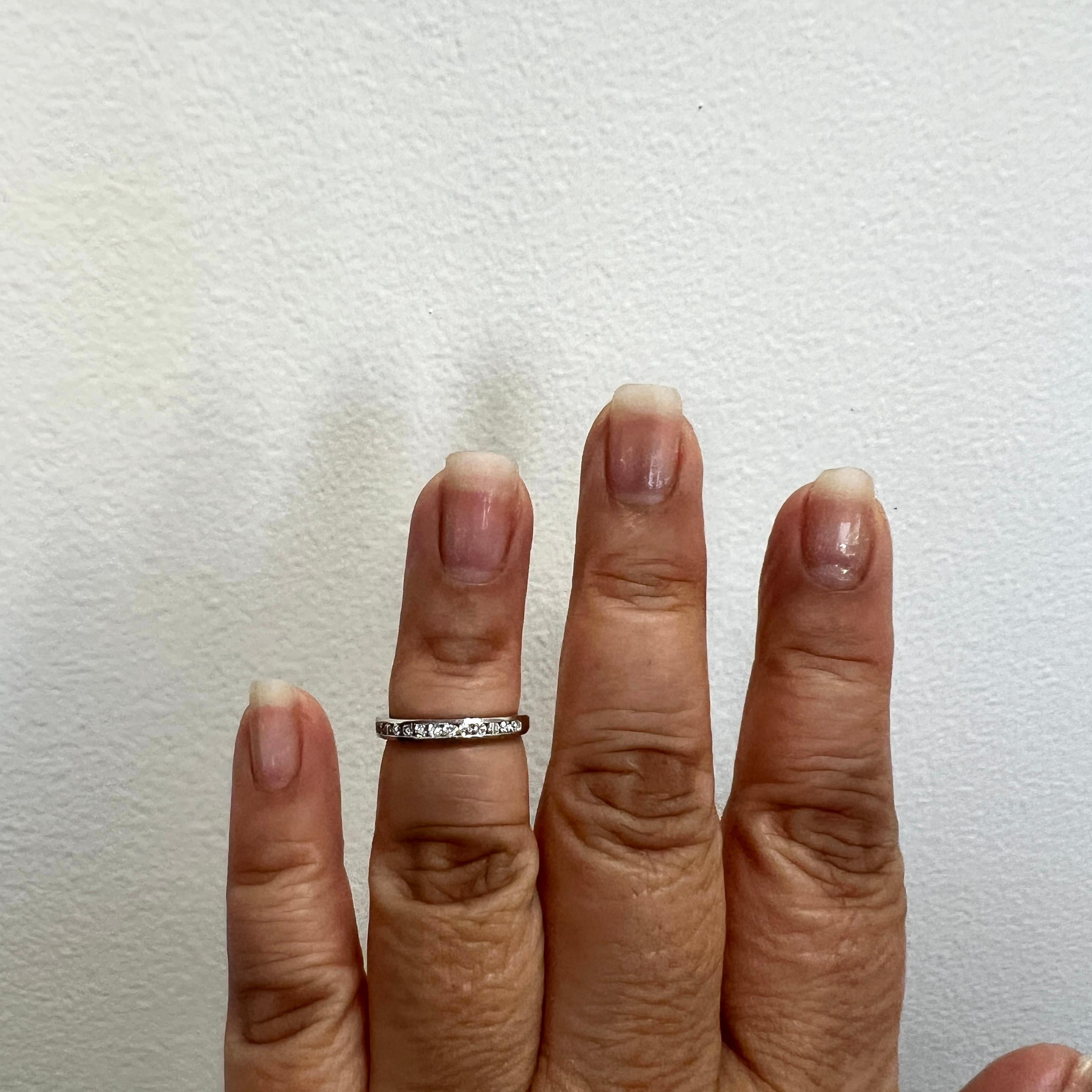 Beautiful estate Tiffany & Company white diamond round band ring.  Handmade in platinum.  Ring size 5.  Comes with original box.