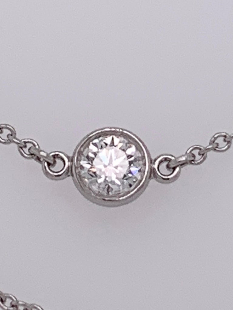Tiffany Elsa Peretti Diamonds By The Yard Necklace. Platinum 950 and Tiffany round diamonds catch the light and make it dance. Necklace in platinum with 20 round brilliant diamonds. 30 inches long. Carat total weight 2.80. Original designs