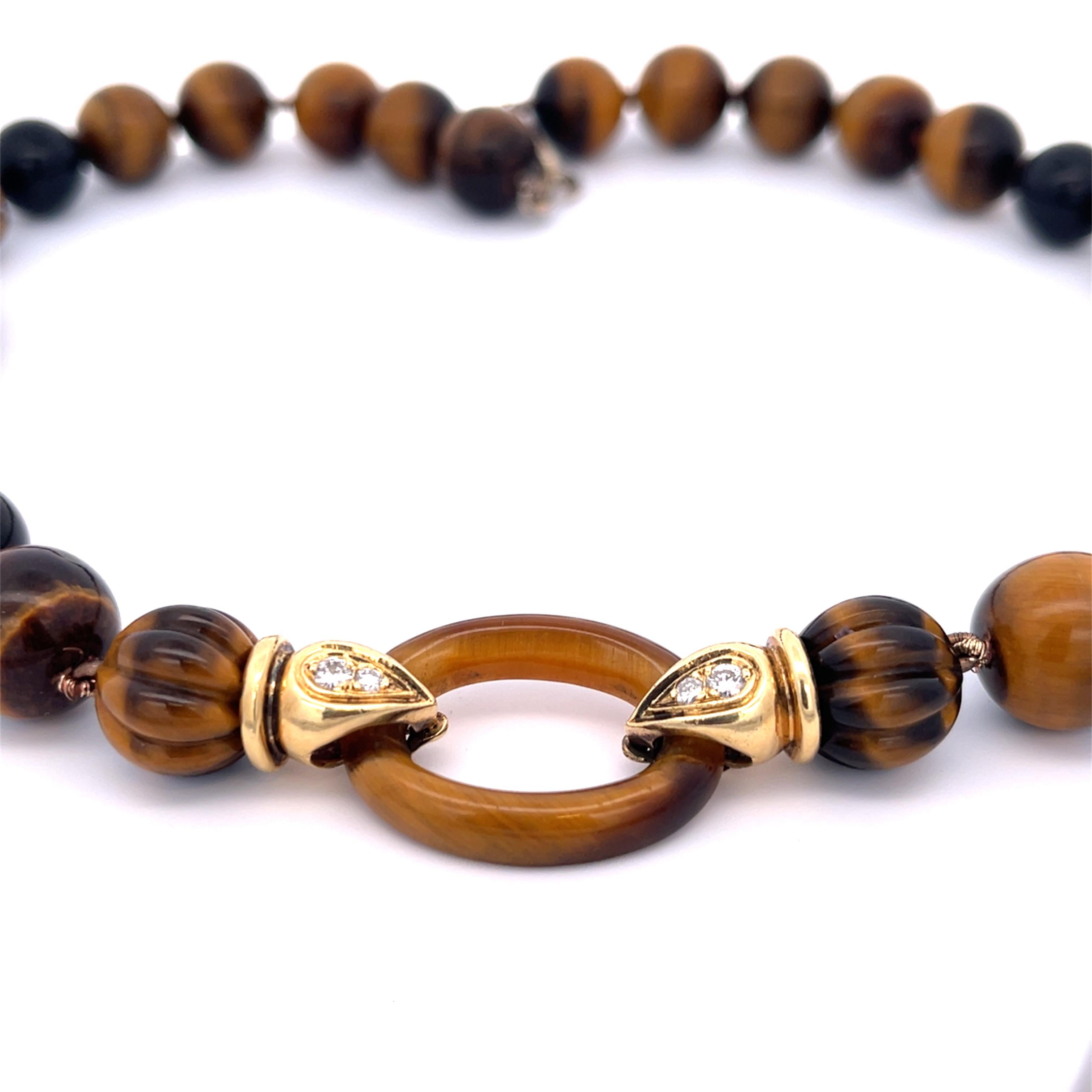 Estate Tiger's Eye Bead Necklace 18K Yellow Gold Circa 1960s. Features 0.90ctw of diamonds. The necklace is 18.5