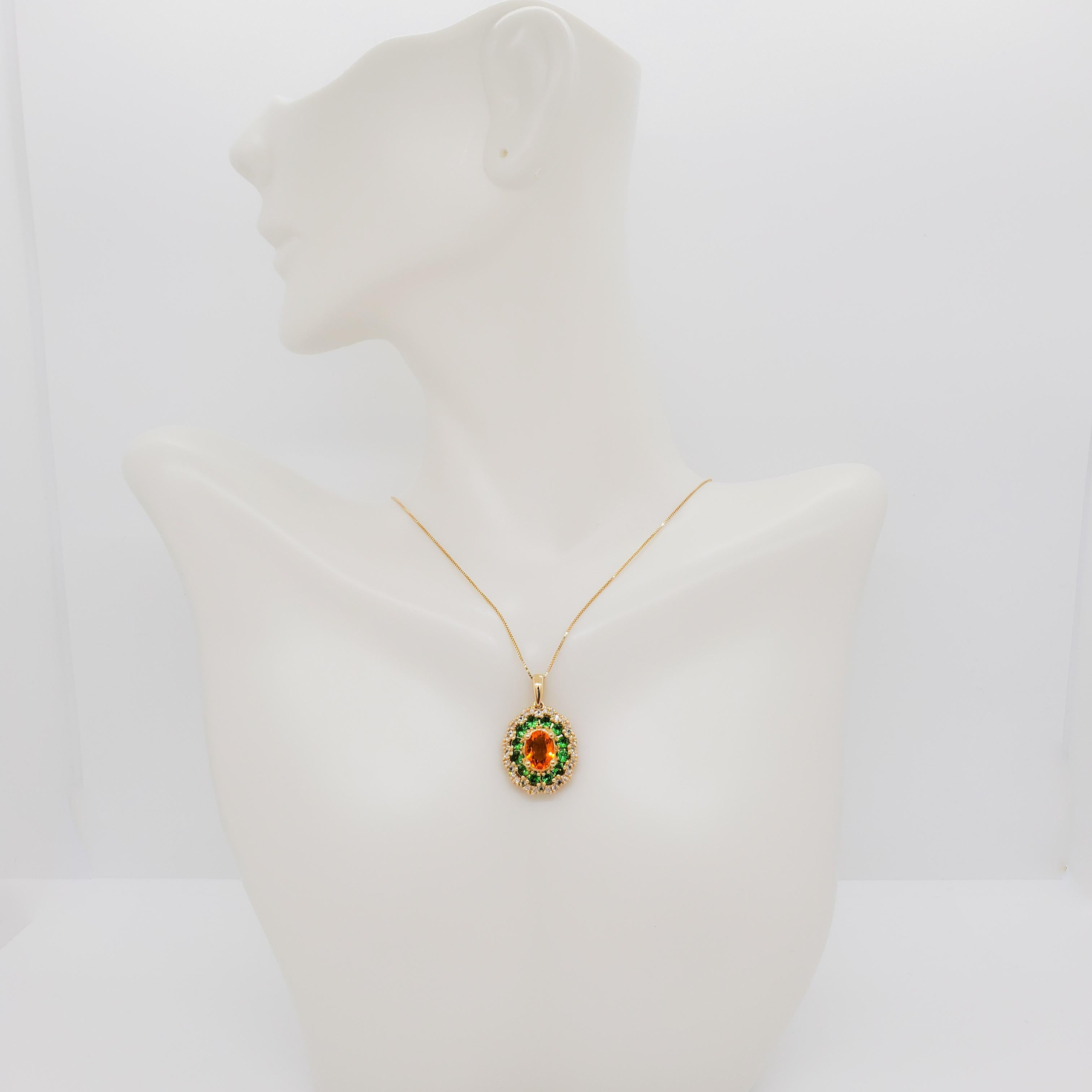 Gorgeous pendant necklace with 1.73 ct. of multi color oval and round topaz and garnets and white diamonds. Handmade in 14k yellow gold.  Chain is 18