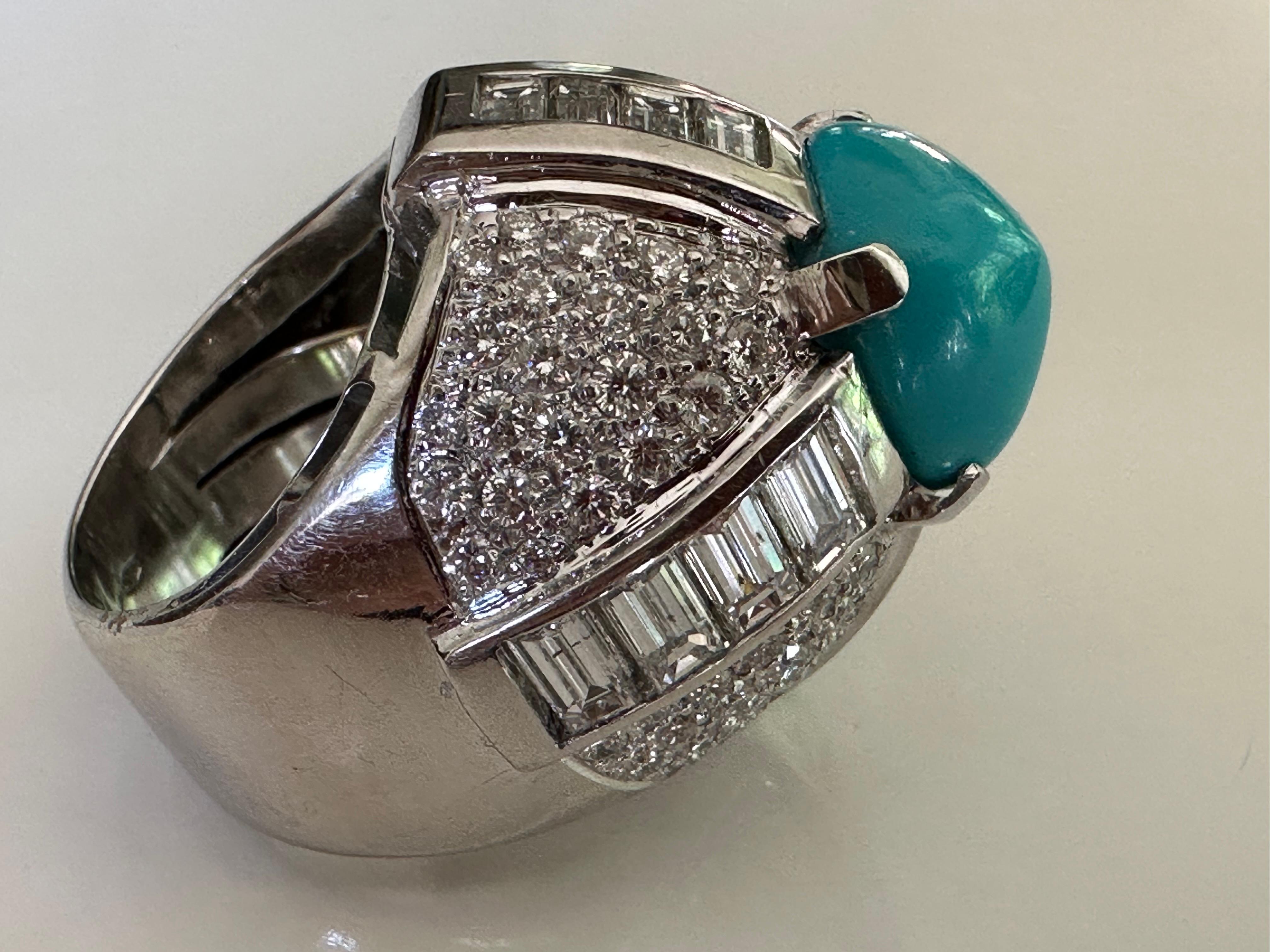 Striking and original, this bold cocktail ring features a square-shaped turquoise cabochon measuring 12x12.5mm surrounded by sixteen baguette diamonds and eighty-eight round-shaped diamonds, pave set, totaling approximately 5.50 carats, GH color,