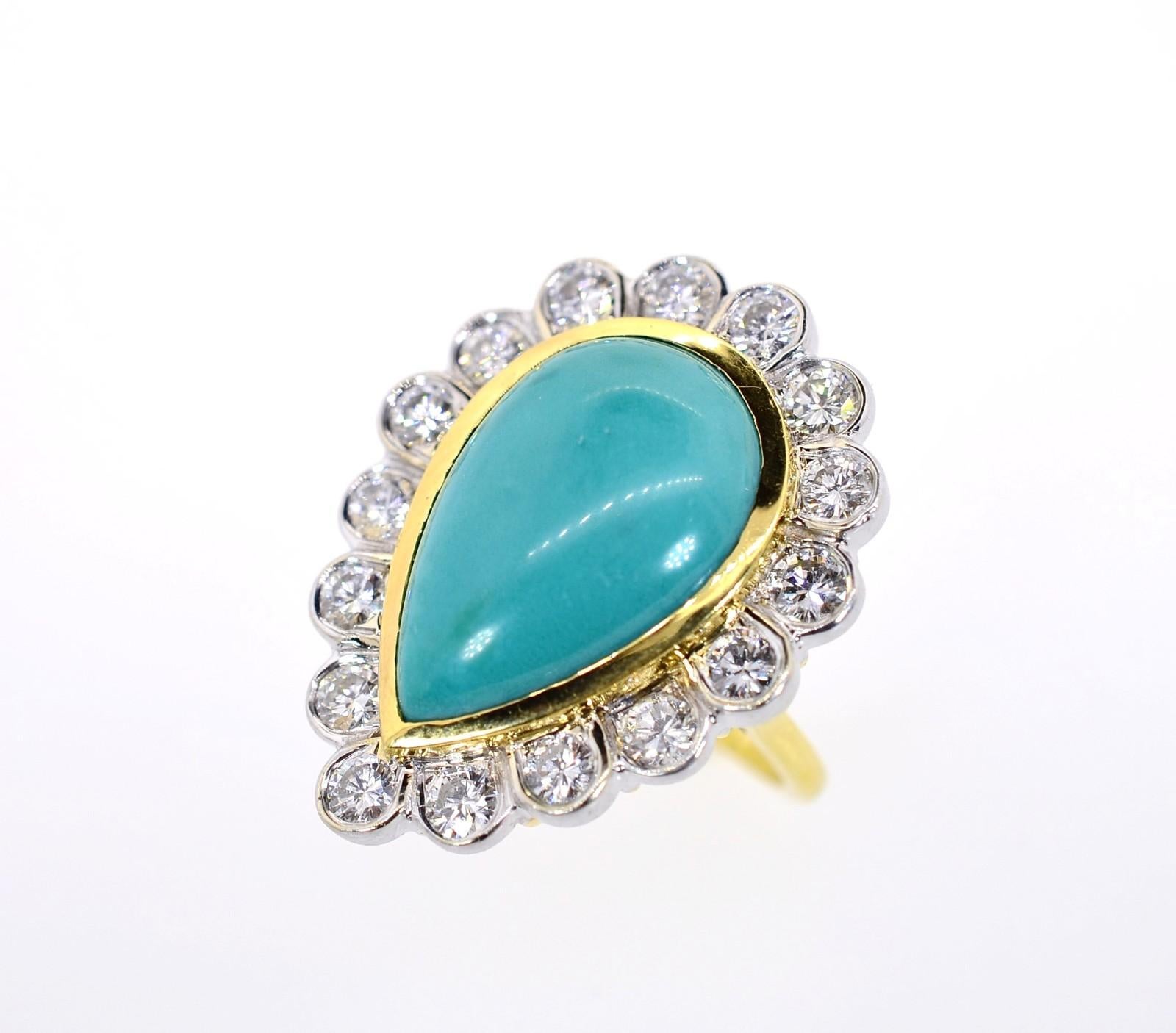 A brilliant 18KT yellow gold ring flaunting a cabochon pear shape Turquoise stone, surrounded by 2.10 carats of Round Brilliant cut Diamonds. The diamonds of H/I color - VS clarity are set in white gold bezels, giving a gorgeous contrast to this