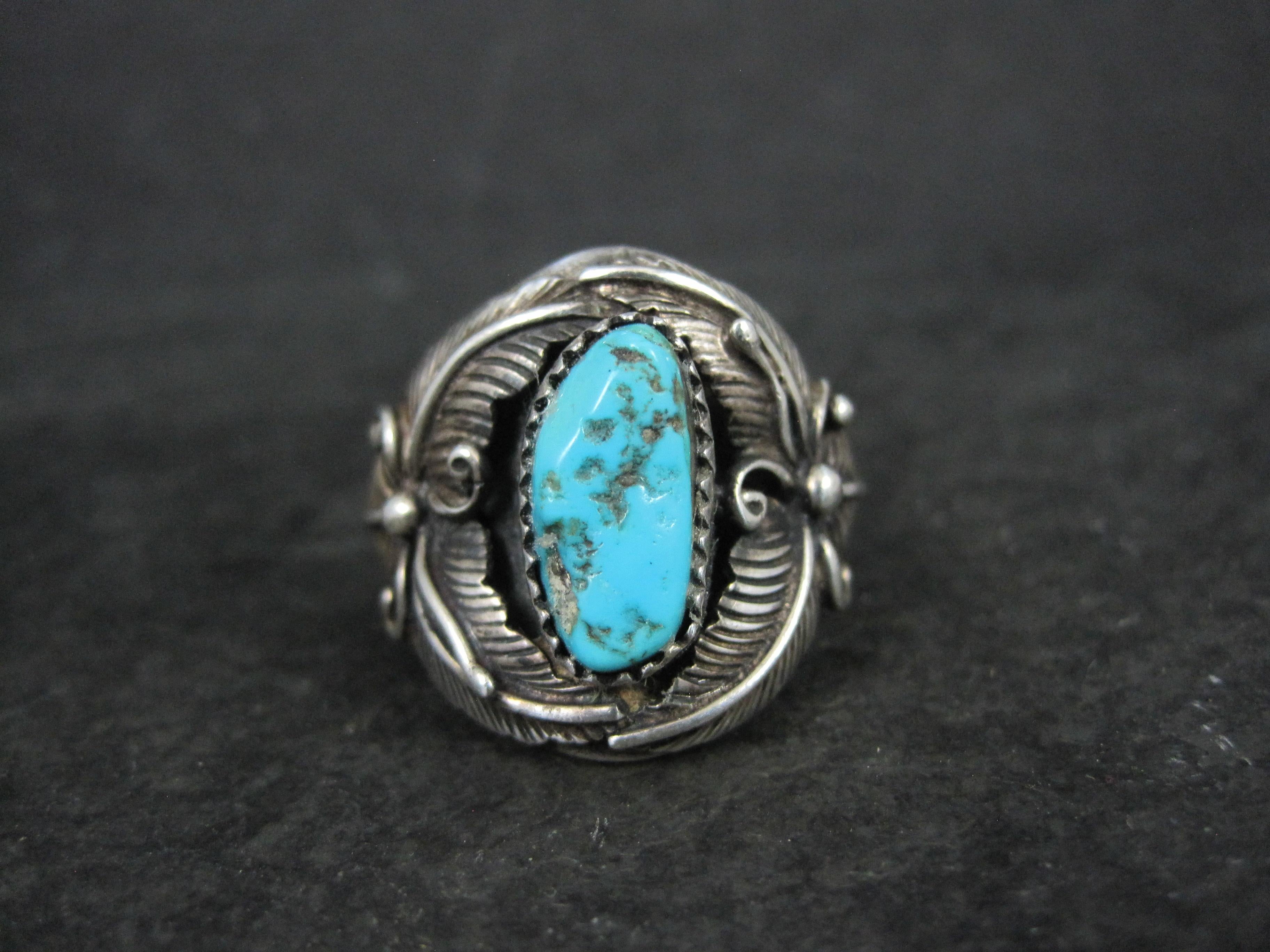 This gorgeous Southwestern ring is an unsigned beauty.

Measurements:
The face of the ring measures 15/16 of an inch from knuckle to knuckle.
The turquoise measures 7x15mm.

The ring is a size 9.

Marks: Sterling