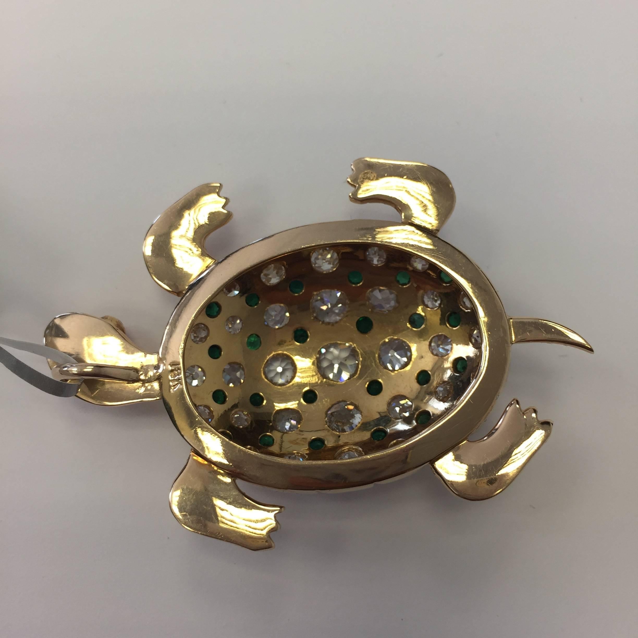 This ornate yet delicate turtle slider pendant showcases 6 carats of diamonds, 2.55 cts of green tsavorites, and pink tourmalines in 18k yellow gold.  Beautifully made and in excellent condition.