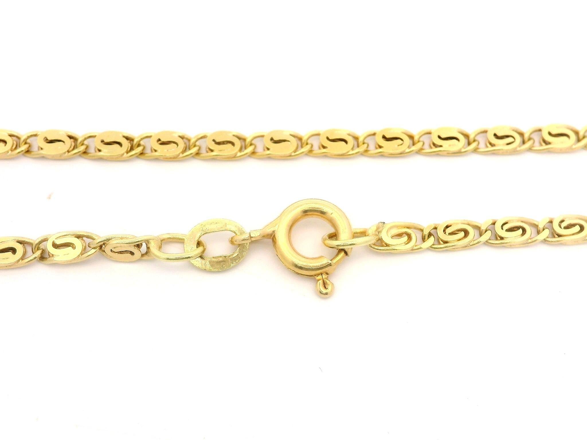 Material: Oro amarillo macizo de 14 quilates
Peso: 7.5 gramos
Tipo de cadena: Cadena de eslabones de ojo de tigre 
Longitud de la cadena: 18 pulgadas (medida junto a la regla)
Grosor/Ancho de la cadena: 2.39 mm (en los eslabones)
Cierre: Anilla de