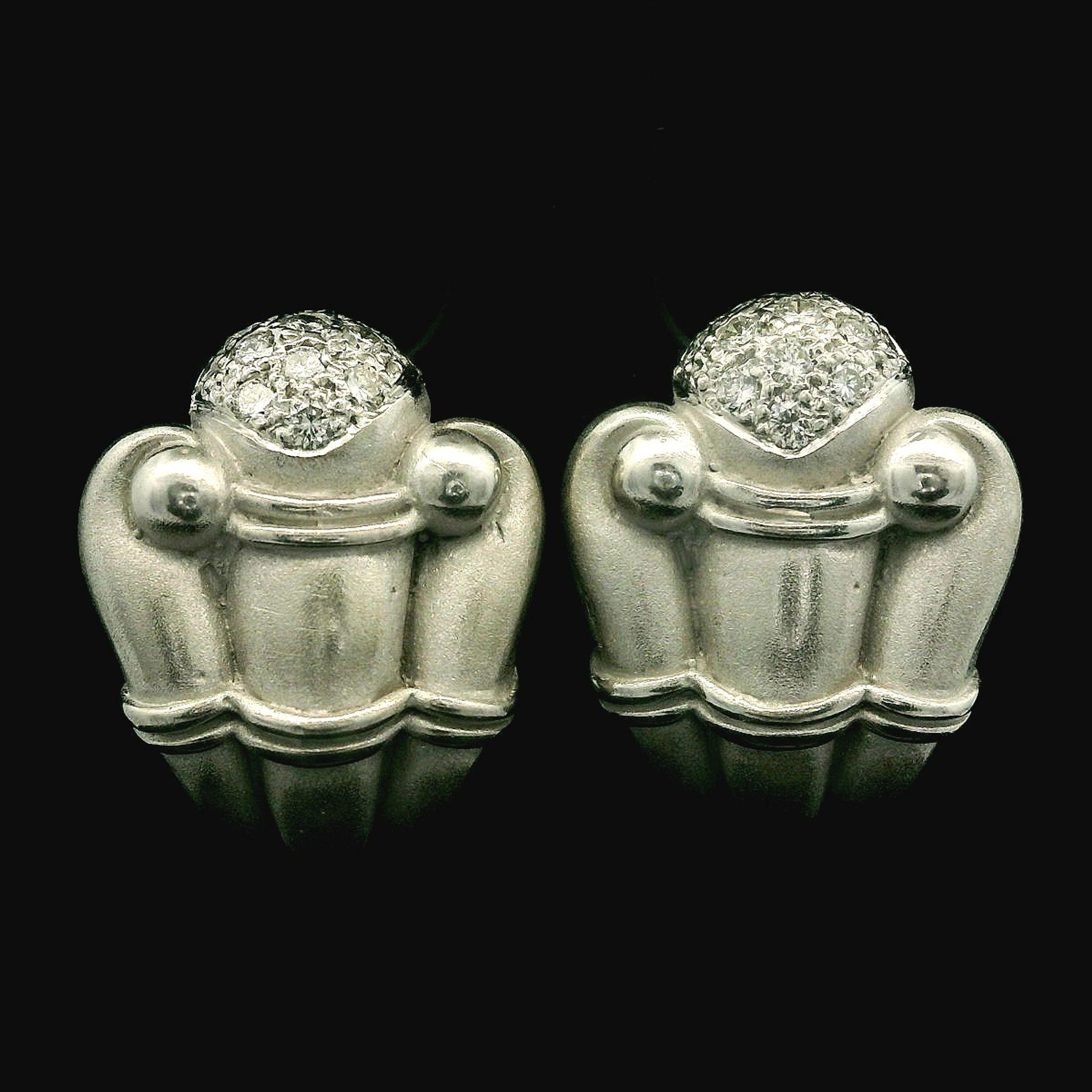 –Stone(s)–
(22) Natural Genuine Diamonds - Round Brilliant - Pave Set - F-G Color - VS1- VS2 Clarity - 0.32ctw (approx.)

Material: Solid  18k White Gold - 14k White Gold Backs
Weight: 14.54 Grams
Closure: Posts w/ Omega Backs (Pierced ears are