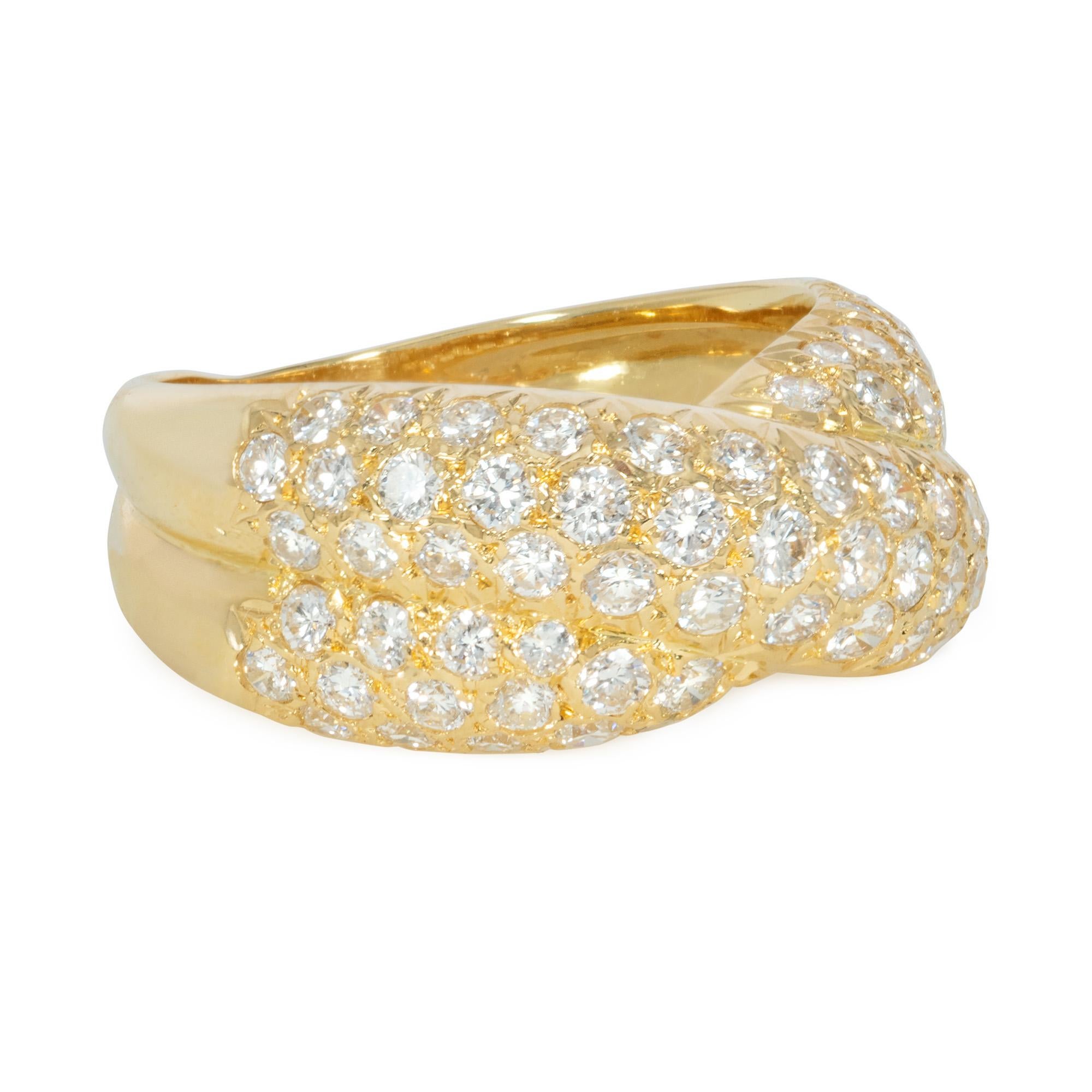 An estate gold and pavé diamond band ring of wrapped, turban/crossover design, in 18k. Van Cleef & Arpels, Paris.  Numbered C5161 A14171.  Atw 1.71 cts.  Width: 9mm

Current size: 6.5; may be reduced in size by means of a spring attached to the