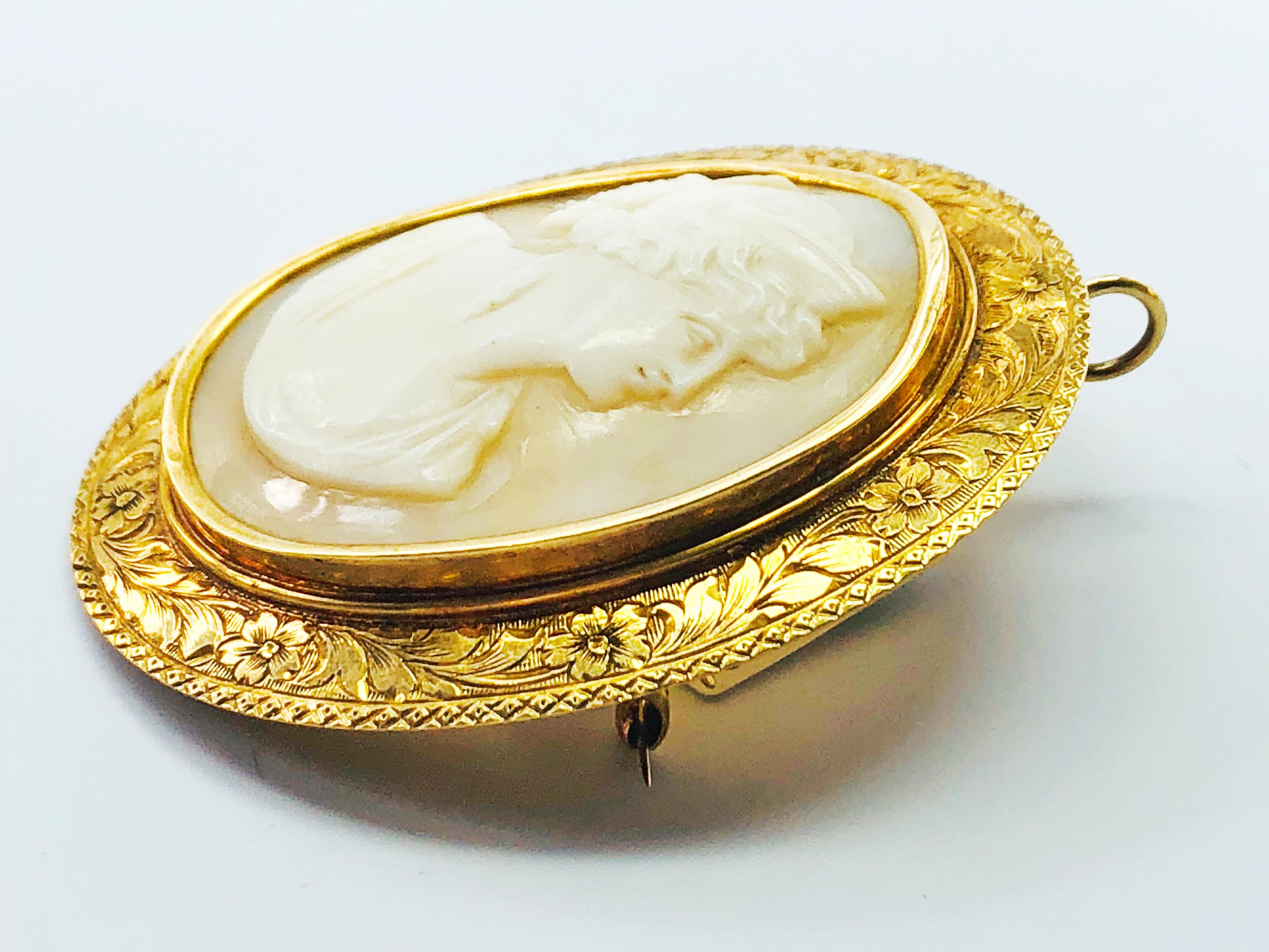 This is a Rare, Victorian, Hand carved, estate, 14K yellow Gold and Shell Cameo. This cameo is in an oval shape and can be worn as a pendant or a brooch and has a stunning engraved yellow gold bezel! The measurements listed below do NOT include the