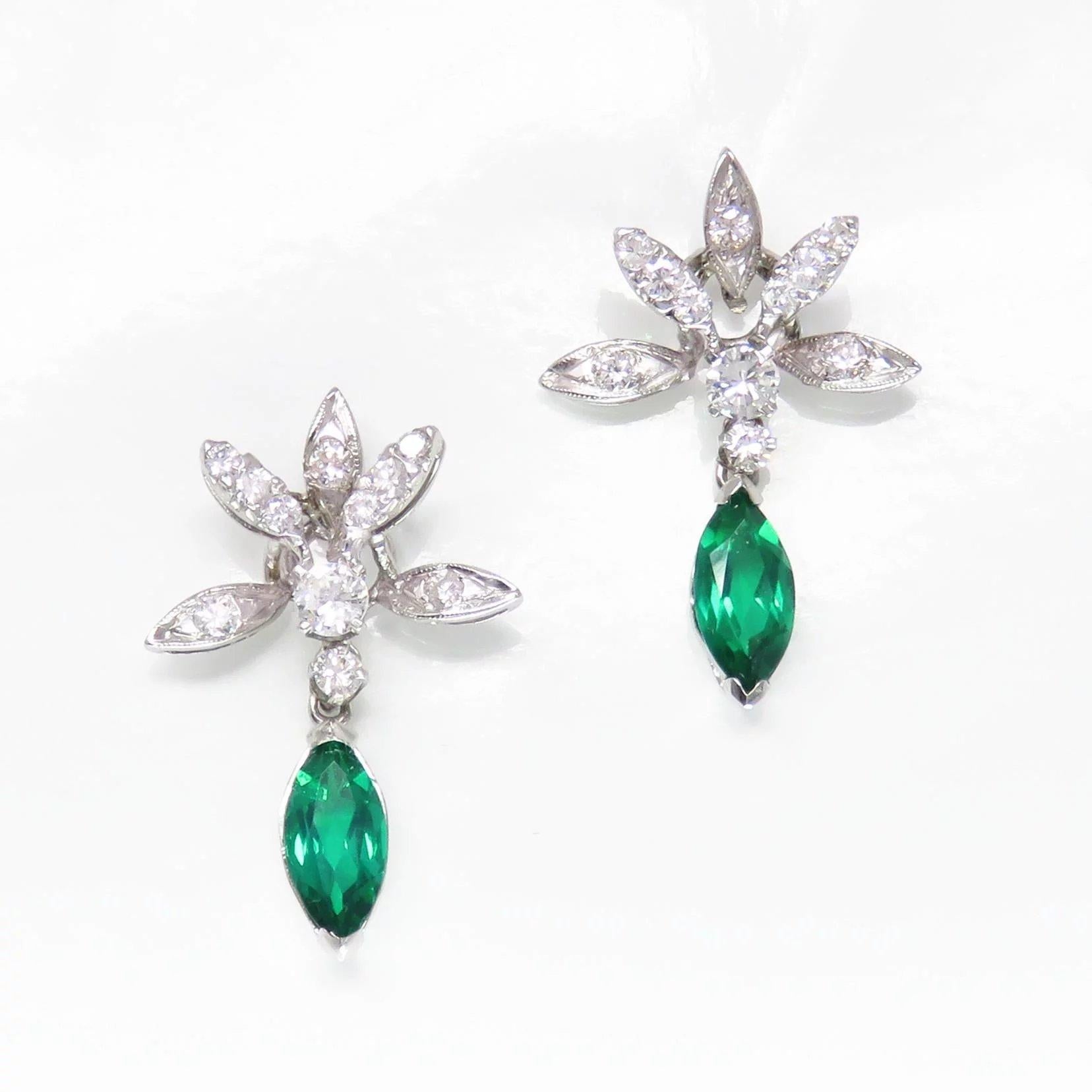 Striking Vintage 14k Gold 2.12 Carat Diamond Emerald Dangle Pierced Earrings

These beautiful festive earrings feature a beautiful 14k gold (white) floral framework, showcasing a total of 22 round brilliant cut white natural diamonds, totaling