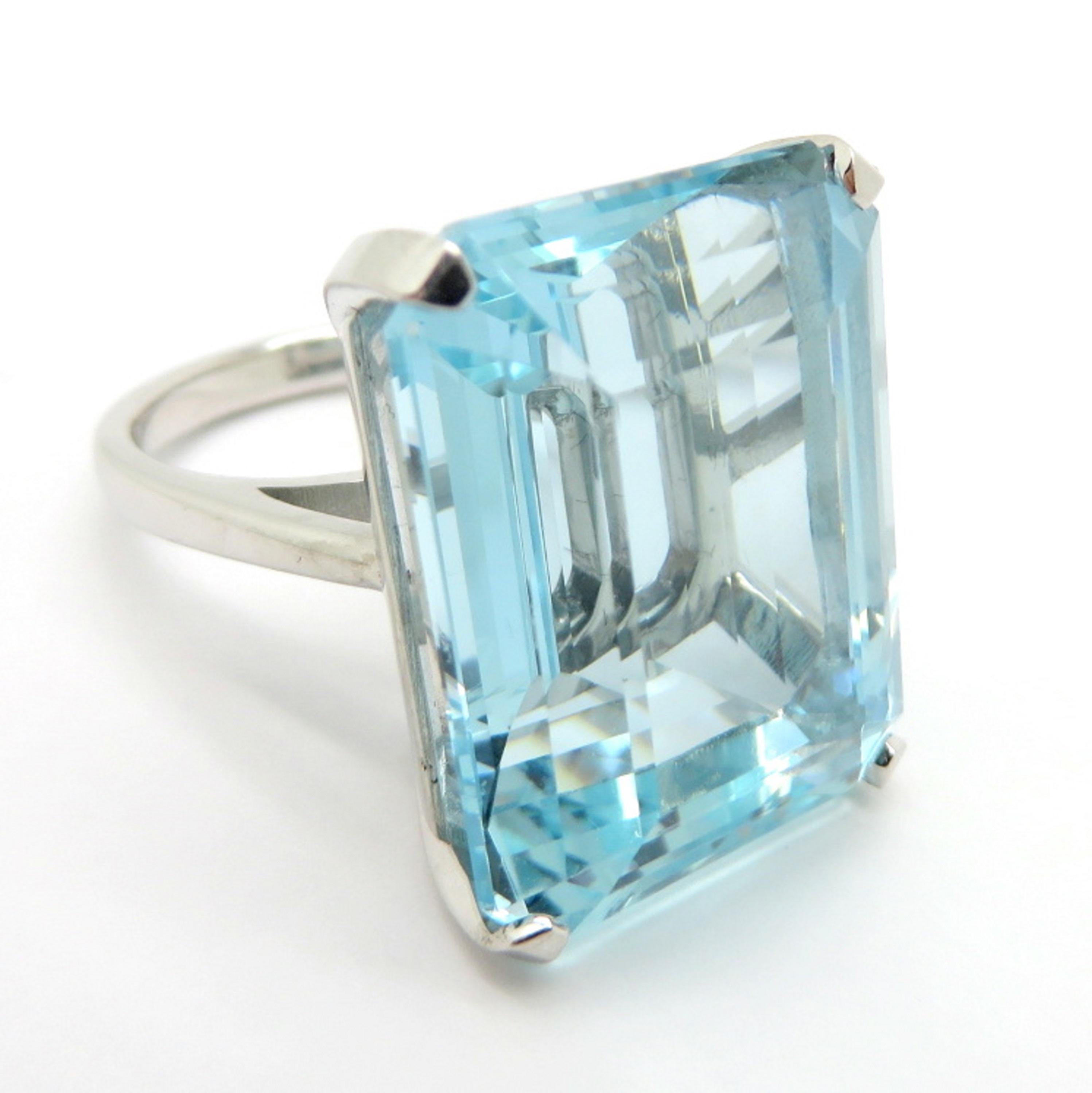 For sale is a large estate vintage emerald cut aquamarine ring!
Showcasing one (1) Emerald Cut aquamarine, basket set in a 14 karat white gold setting weighing approximately 36.18 carats.
Hallmarked 14K and the ring has a high polish finish.
The