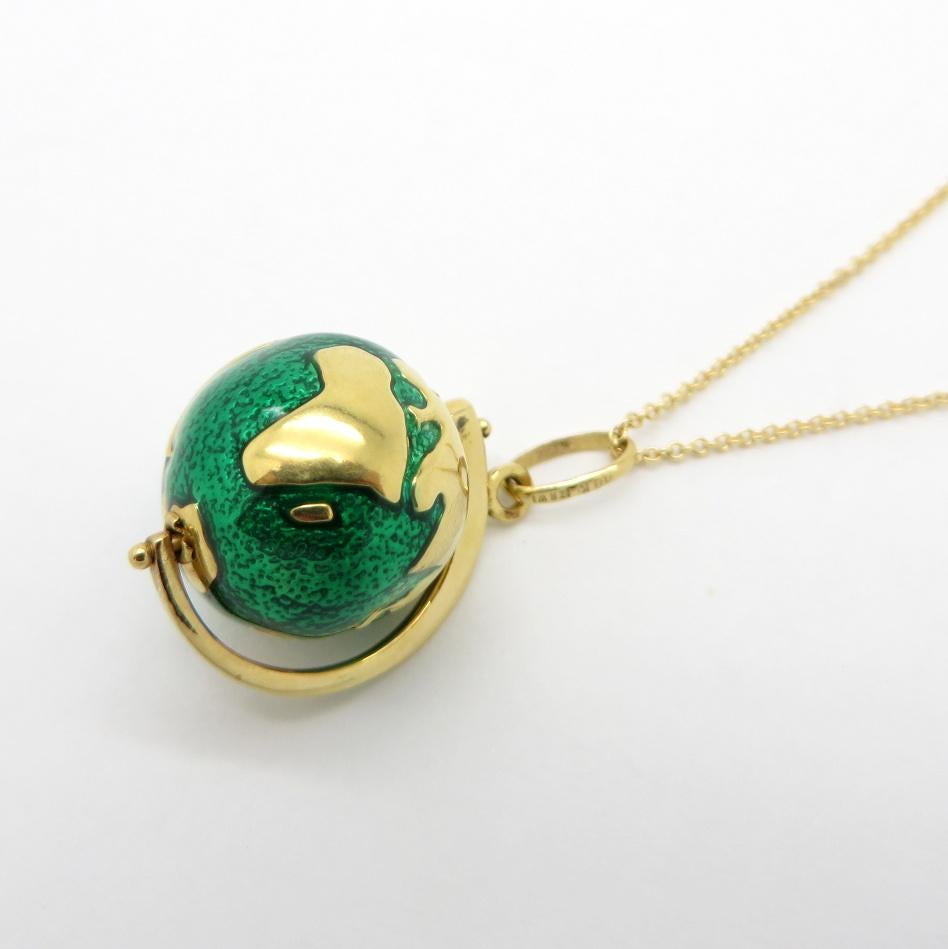For sale is a modern 18K Yellow Gold Green Enameled Globe Necklace!
The globe pendant measures 15.00 mm in diameter.  
The chain measures 16” inches long and the clasp is hallmarked 18Kt Italy.
The globe is hallmarked ZRW 18K.
The total net weight