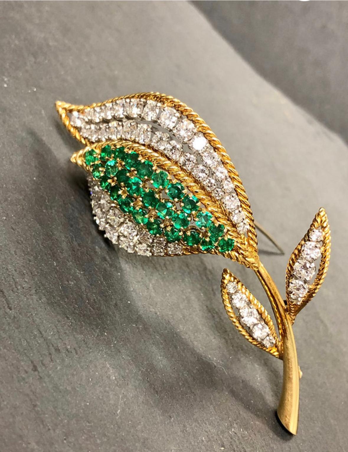 A beautifully made vintage brooch circa the 1960’s done in rich 18K yellow gold and platinum. It has been set with approximately 3.75cttw in G-H Vs clarity round diamonds and finished with vibrantly green natural emeralds.

Dimensions/Weight
2 3/4”