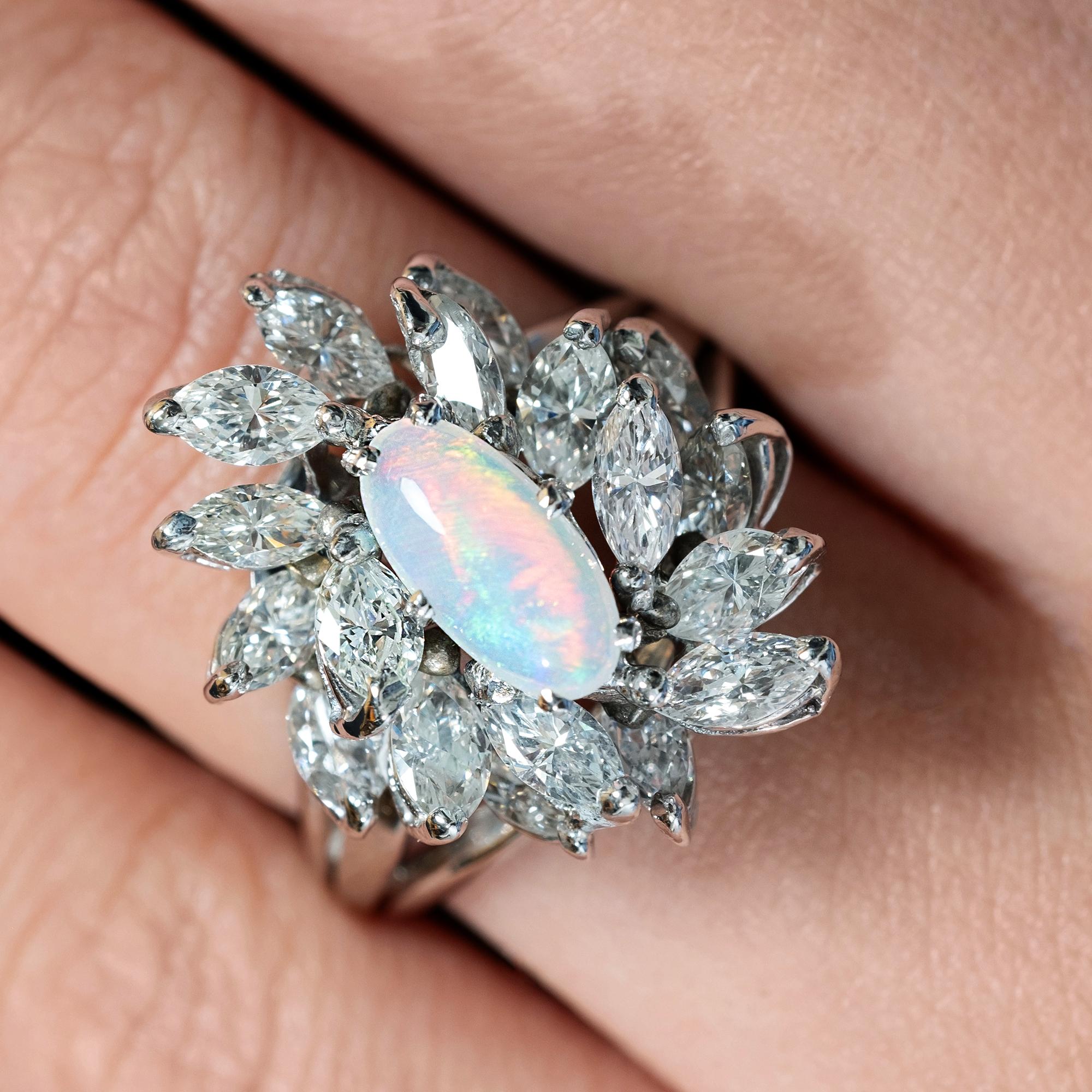 Estate Vintage Ballerina Cluster Platinum Spray Ring with Australian Opal and Diamonds - a Fabulous jewel of Golden Age Hollywood.
The Center is Australian Crystal Opal is Simply Stunning with a Gorgeous Array of All the Colors, measuring