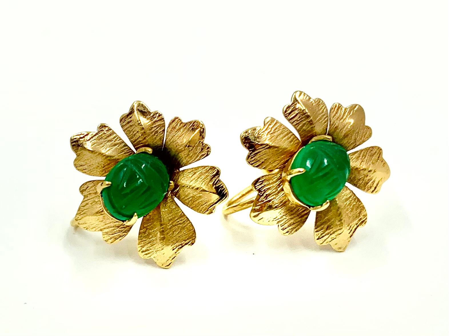 Carved green chrysoprase scarabs set on beautifully detailed 14K textured yellow gold flowers.
The backs with original screw-back closure.
Ancient Egyptians revered the scarab as a symbol of transformation, immortality and protection. 
A classic