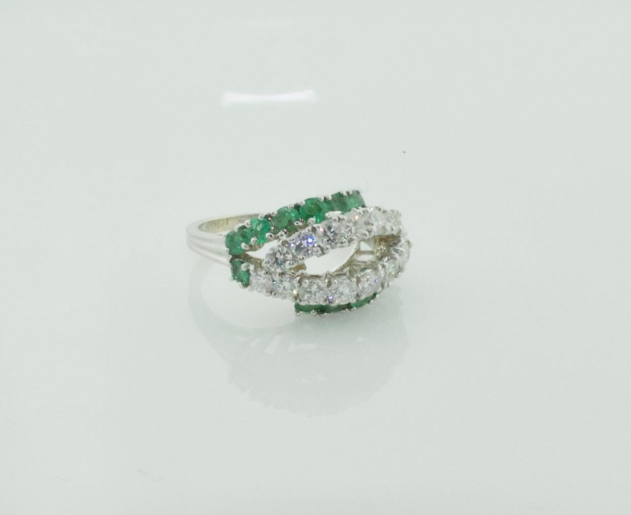 Estate Vintage Emerald and Diamond Ring in 18k White Gold
Introducing our Estate Vintage Emerald and Diamond Ring in 18k White Gold - a true masterpiece of fine jewelry. This exquisite ring features a stunning combination of emeralds and diamonds,