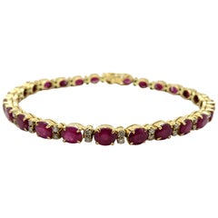 Estate Vintage Oval Ruby and Round Diamond 18 Karat Yellow Gold Tennis Bracelet