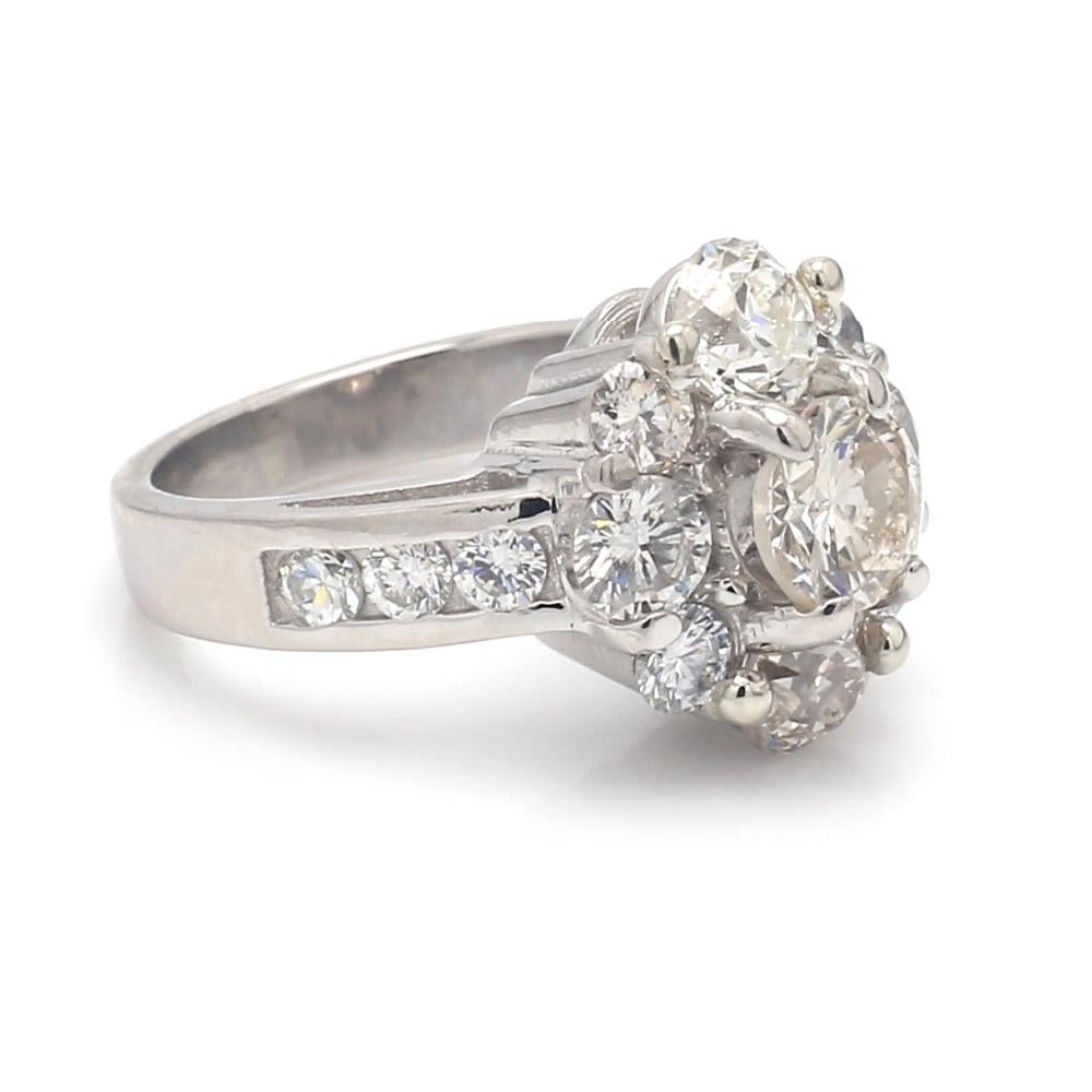 Platinum, flower motif ring. Ring is set with fifteen (15) round brilliant cut diamonds weighing approximately 3.00ctw. Ring 12.0 grams and is a size 4.25. All questions answered. 
All reasonable offers are considered!