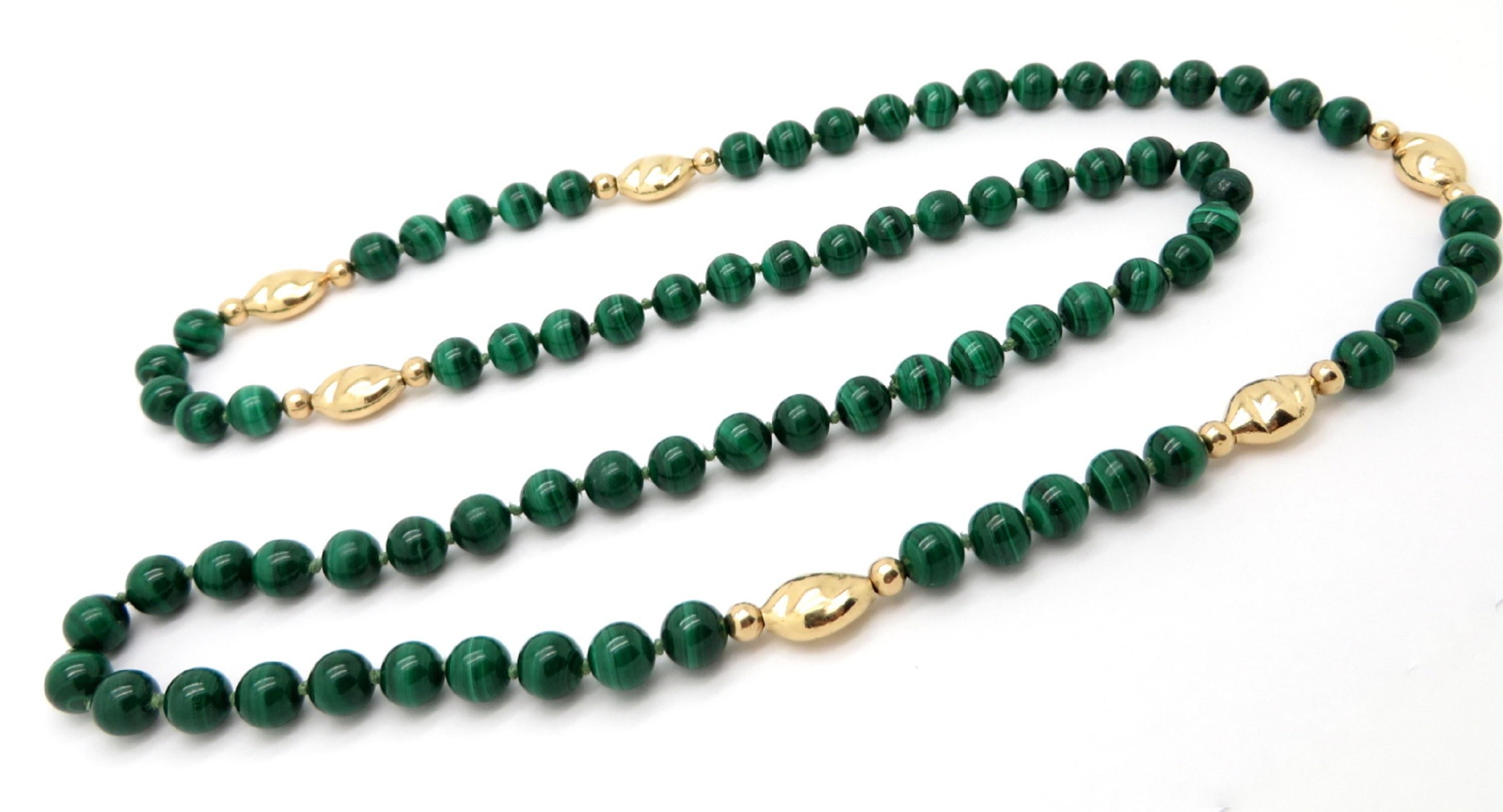 For sale is a beautiful malachite beaded necklace with 14 karat yellow gold decorative beads!
The necklace measures 33” inches long.
Each malachite bead measures 8.10 mm average.
There are 79 malachite beads interspersed with 18K yellow gold beads