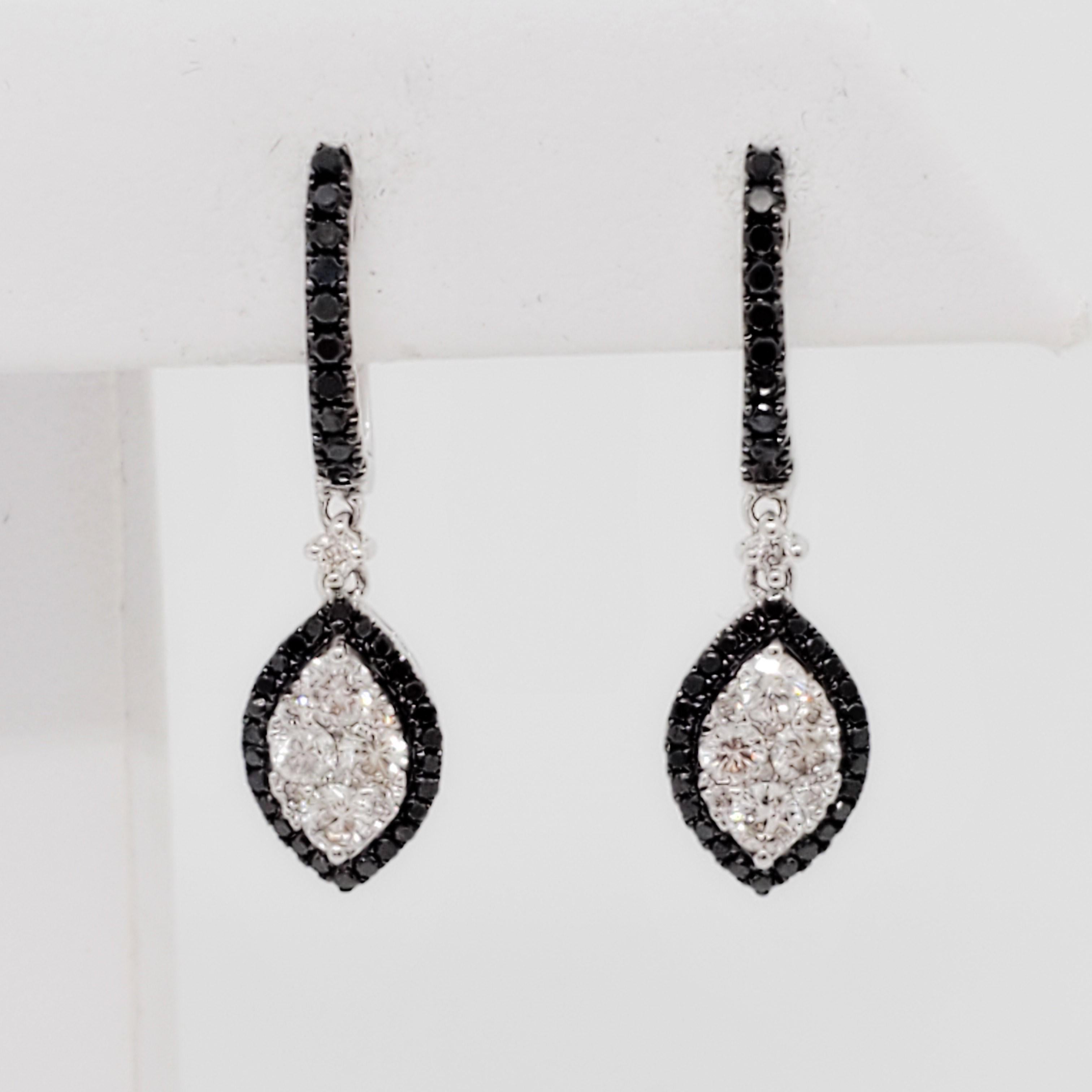 Gorgeous drop earrings with 0.93 ct. of white and black diamond rounds.  Handmade 14k white gold mountings.