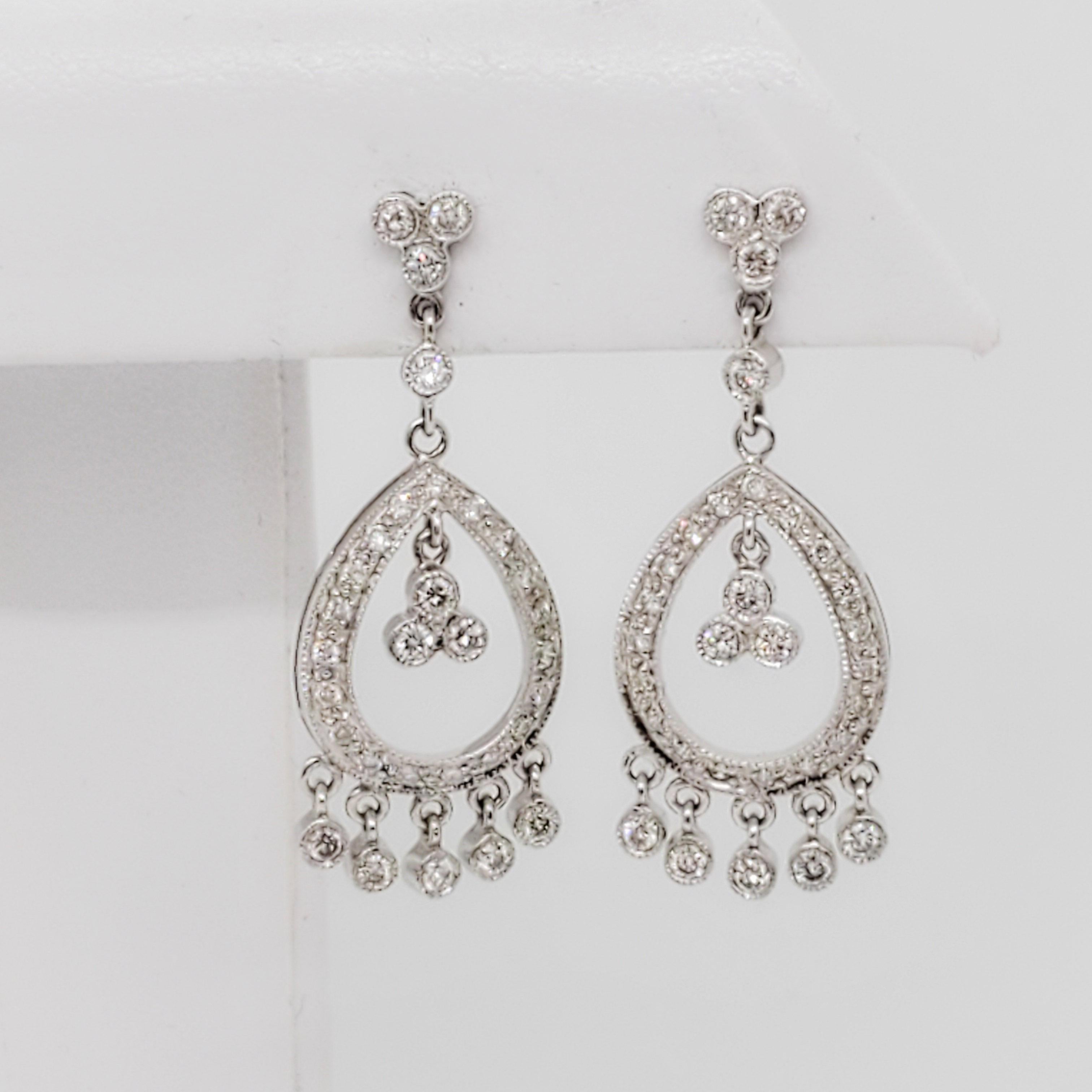 Beautiful earrings with 1.00 ct. of good quality, white, and bright diamond rounds.  Handmade in 18k white gold.