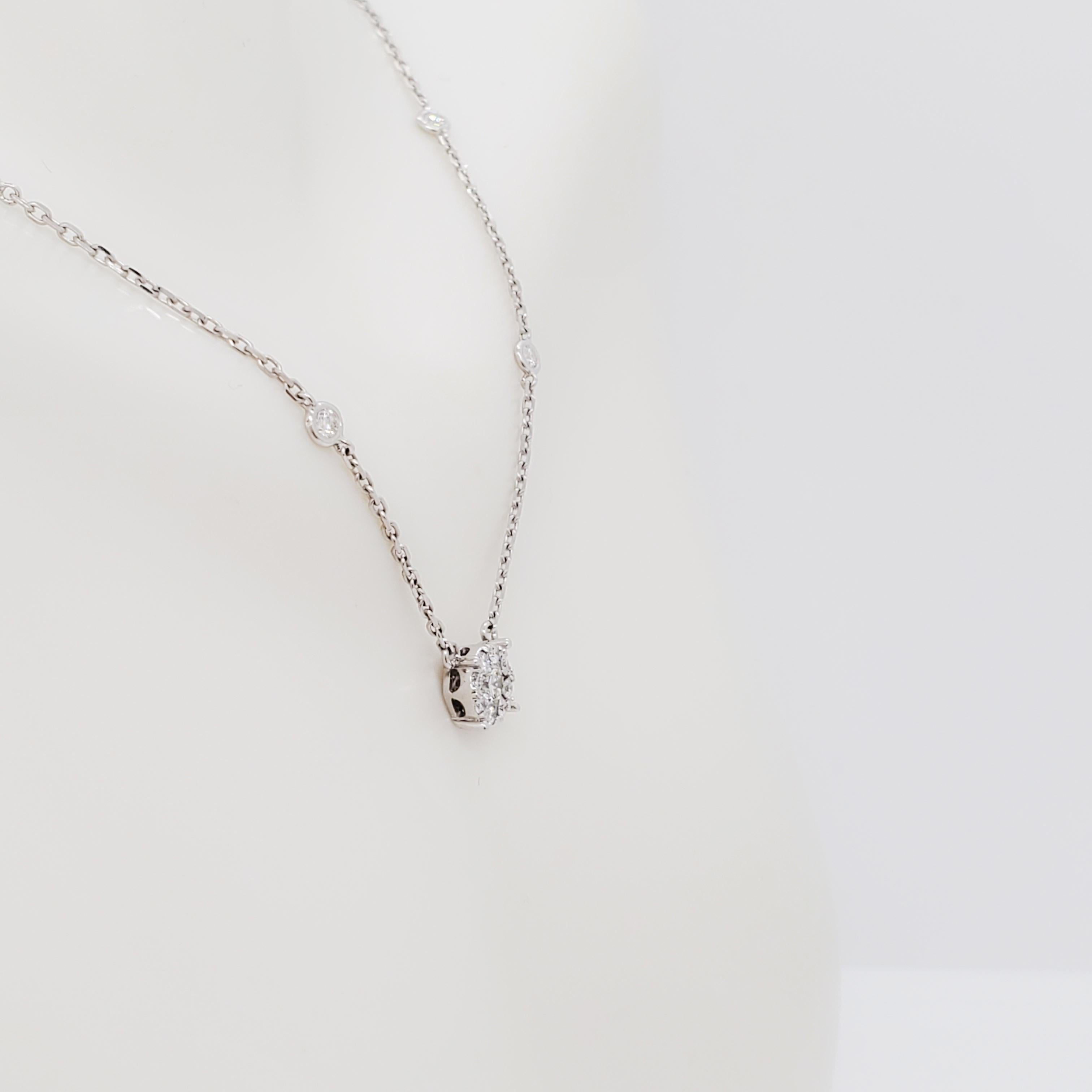 Beautiful necklace with 0.60 ct. good quality, white, and bright diamond rounds in a cluster design.  Diamonds on the chain give this necklace an elevated look.  Handmade in 14k white gold.  Length is 18