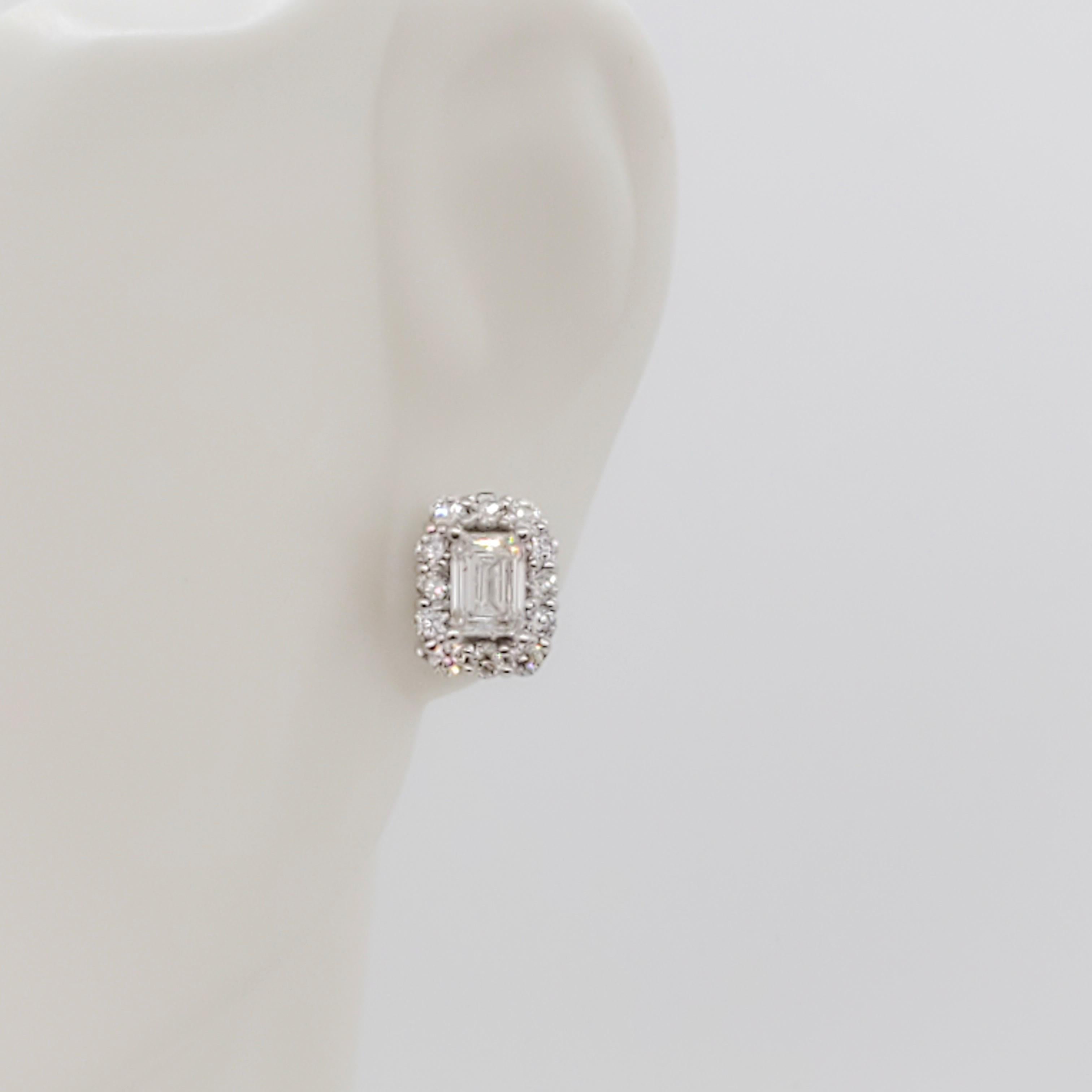 Gorgeous 0.38 ct. good quality, white, and bright emerald cut diamonds with 1.20 ct. good quality white diamond rounds. Handmade 14k white gold mounting.
