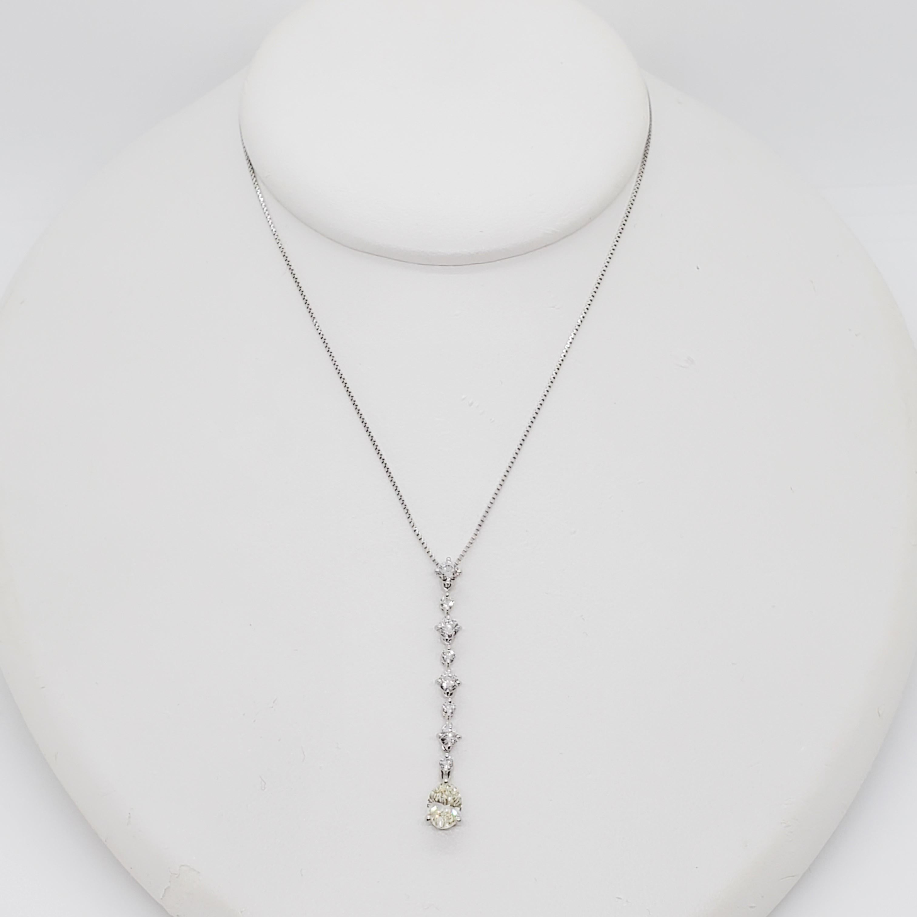 Gorgeous white diamond pendant necklace featuring a 0.76 ct. white diamond oval with 0.60 ct. white diamond rounds in a handmade platinum mounting and chain.  Perfect for everyday or a formal occasion. Mint condition.