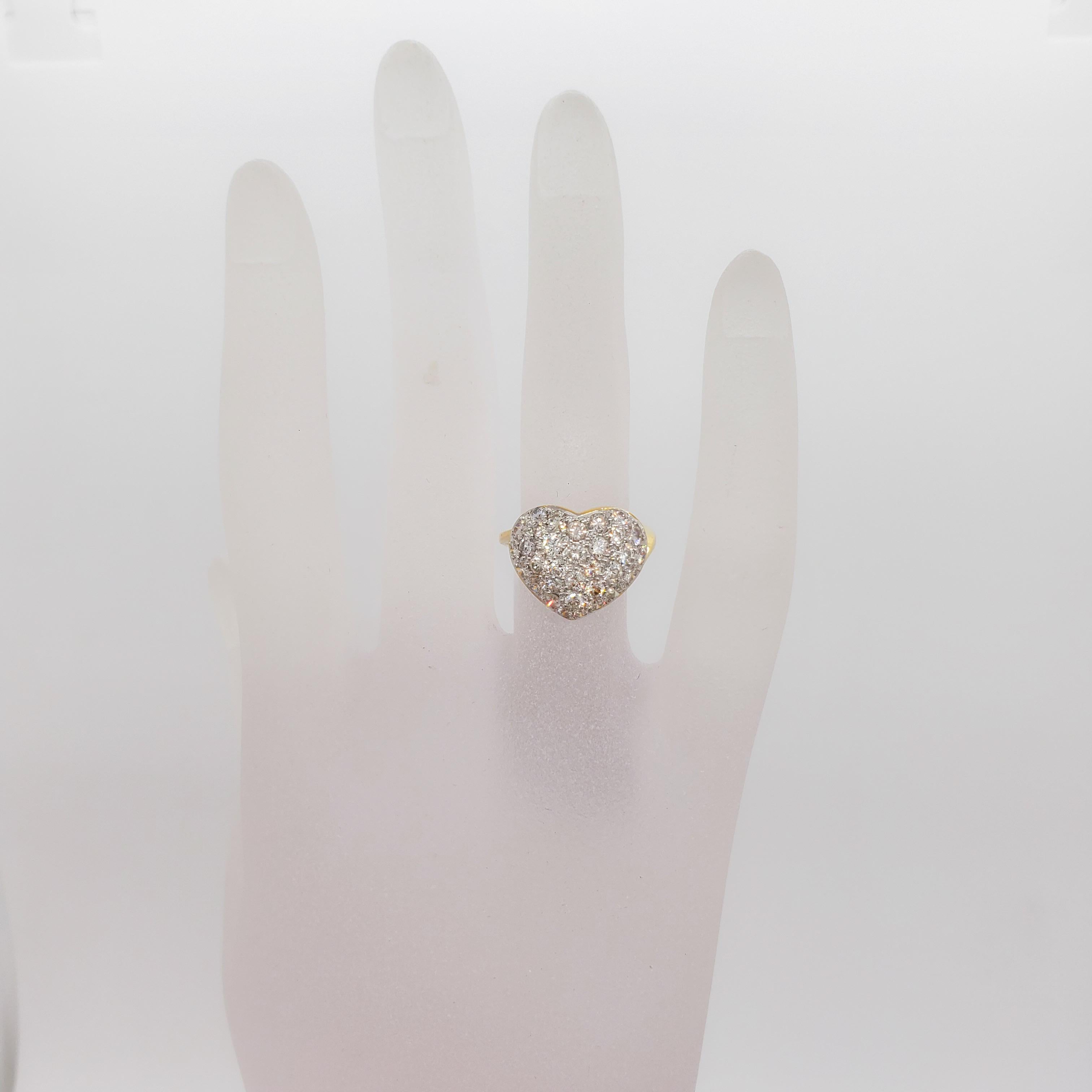 Beautiful estate ring with 1.70 ct. of good quality, white, and bright diamond rounds in a pave heart.  Handmade 18k yellow gold mounting in size 5.75.  Mint condition.