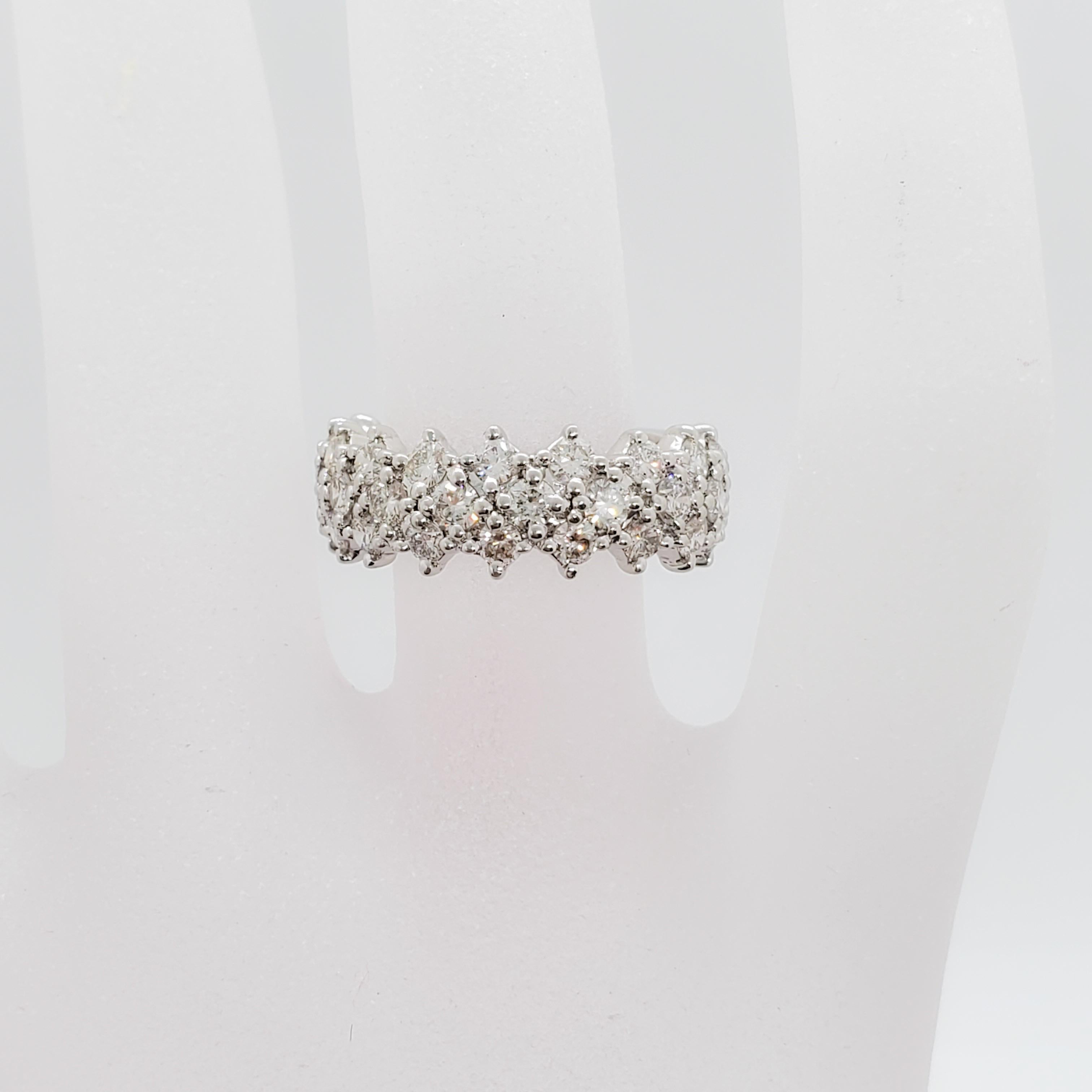 Classic estate diamond band with 2.50 cts of good quality, white, and bright diamond rounds.  Handmade in platinum in size 6.5.