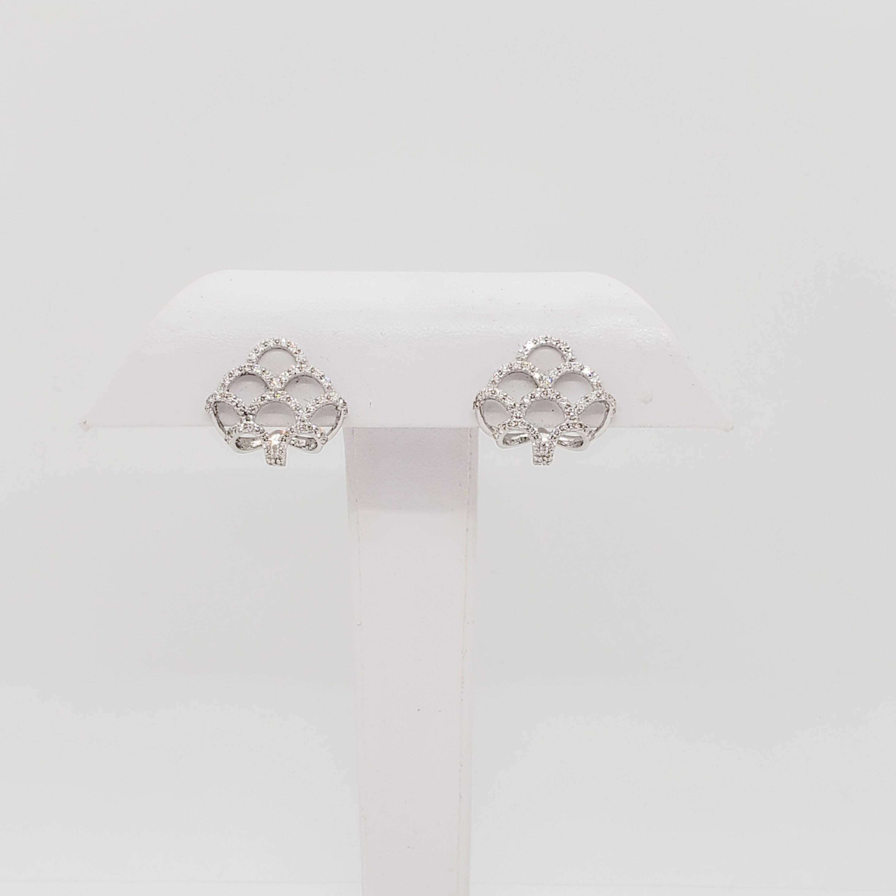 Beautiful earrings with 1.03 ct. good quality, white, and bright diamond rounds in handmade 18k white gold mountings.