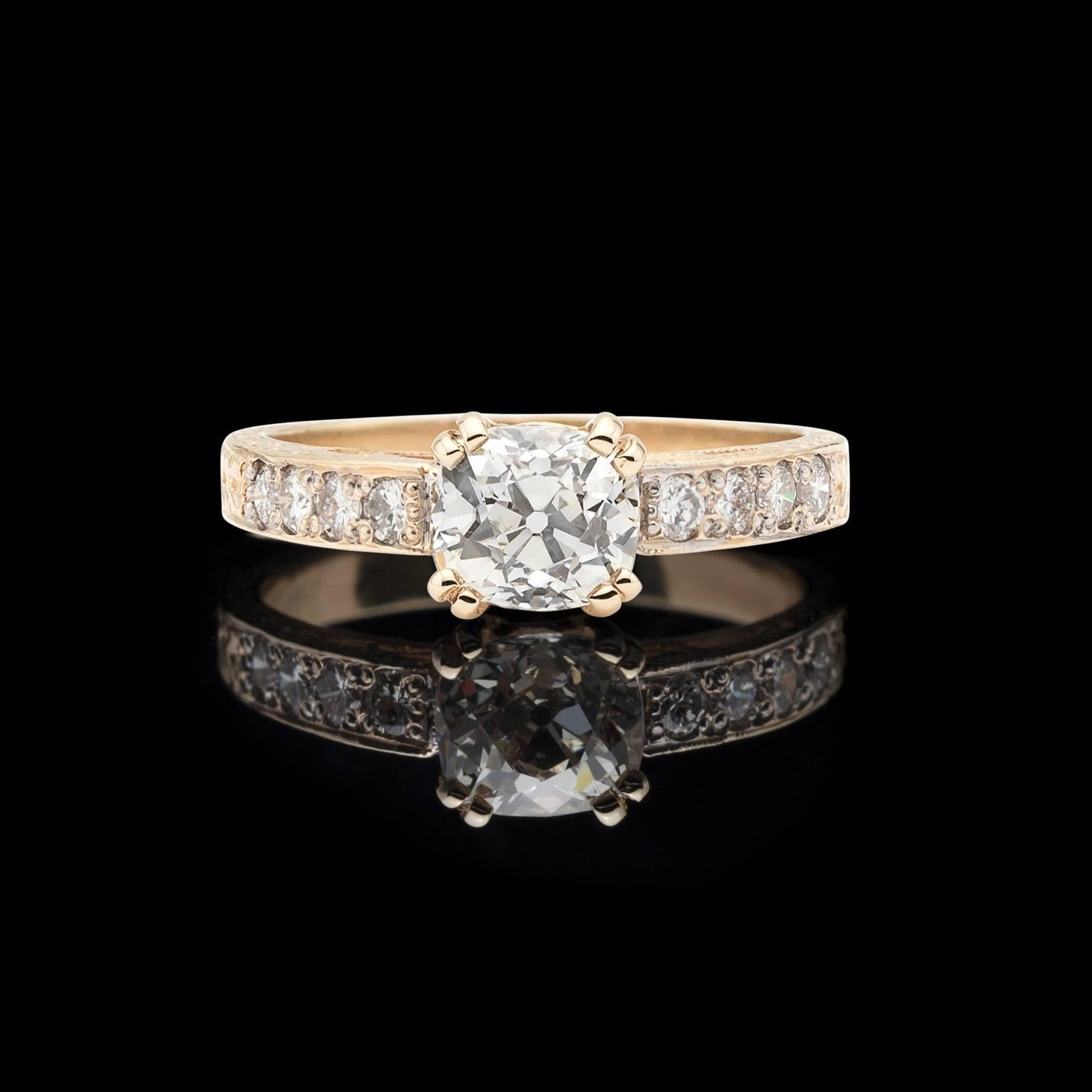 This gorgeous Old Mine Cut Diamond horizontally set in an eye catching 14kt Yellow Gold ring is as elegant as it is timeless. The center stone weighs 1.07 carats and comes with EGL report US905899207D which grades the diamond as I/VS2. This gorgeous