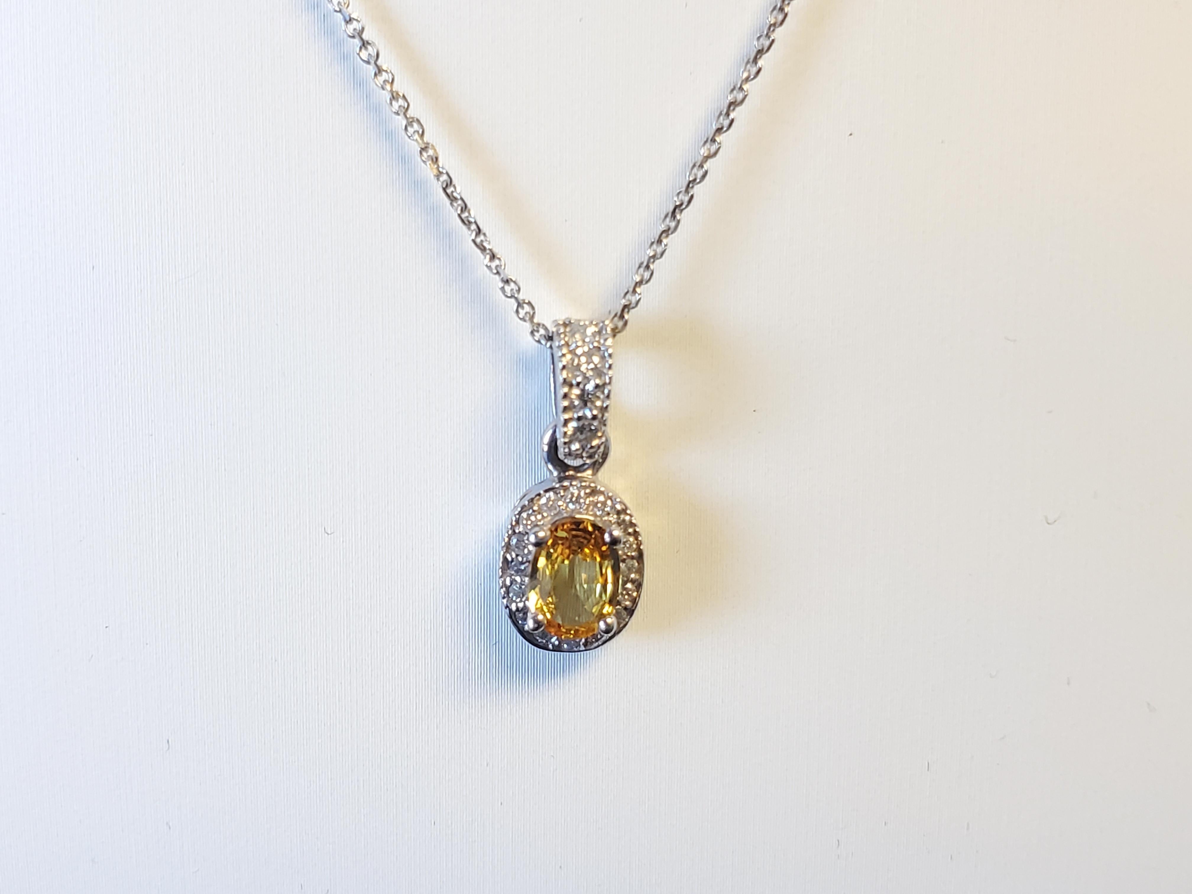 Listed is an estate 14k white gold oval sapphire and diamond necklace. The piece is in great condition and ready to be shown off. The necklace features a nice clean oval yellow sapphire 7x5mm around 1ct with .24tcw G-H I1 quality round brilliant