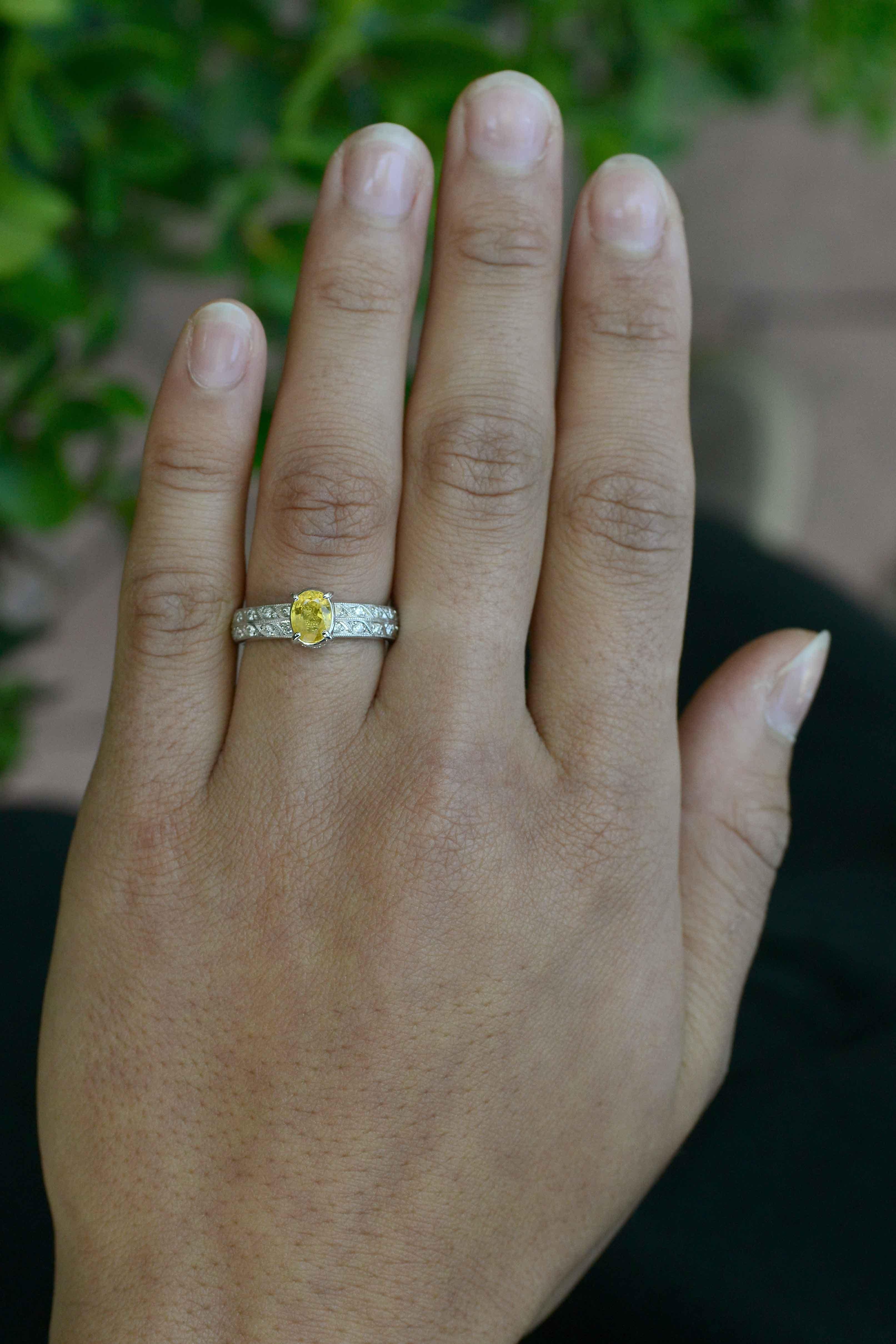 The Pueblo yellow sapphire engagement ring. An eminently wearable oval solitaire gemstone with a bright, lively canary yellow sapphire is really brought to life with a substantial 2 row diamond band and crown setting. Worn as a stacking ring, really