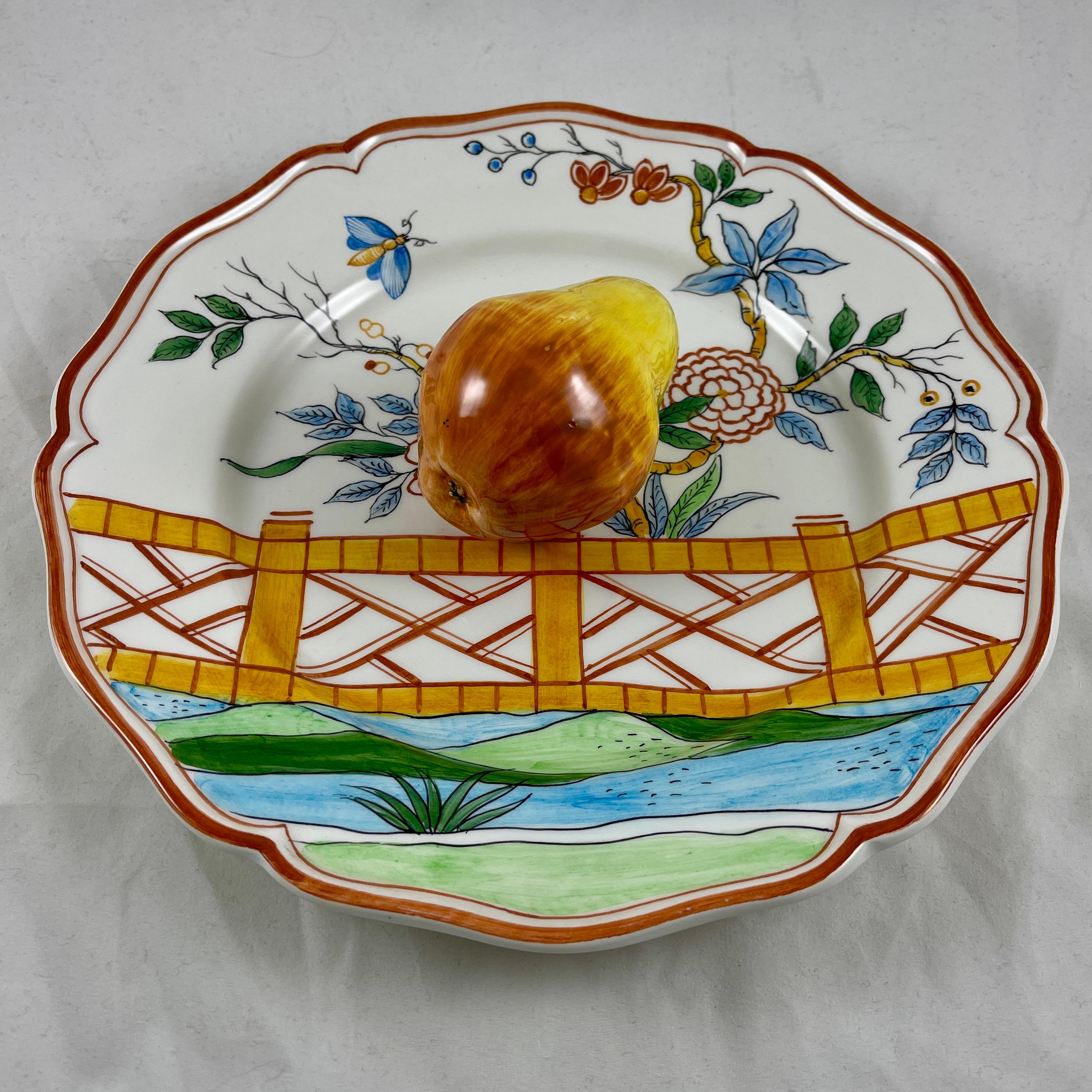 A charming Trompe l’Oeil plate in the Chinoiserie style by Este For Tiffany & Co. made in Italy, circa mid 1970s to the early 1980s.

The ceramic plate or wall plaque shows a life-size, three dimensional pear centrally seated on a plate