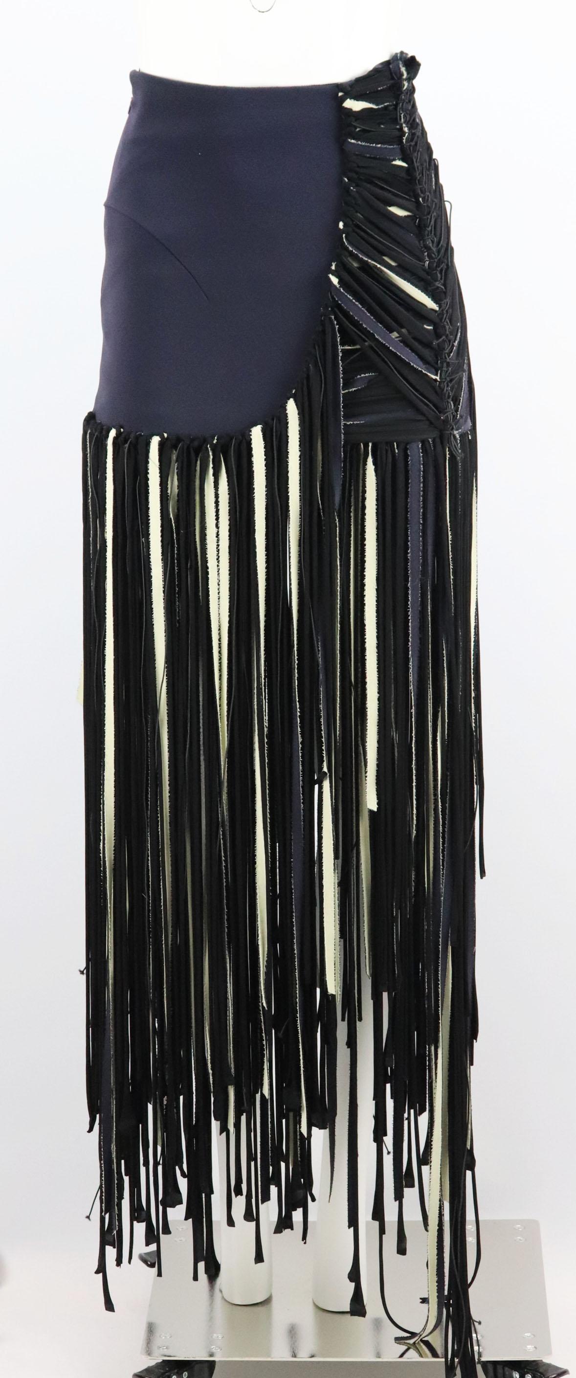 Esteban Cortazar's Italian-made maxi skirt is cut from ottoman-cady that smooths your curves.
It's finished with rows of floor-sweeping cream and black shredded fringing, and has a slashed-effect side for a flattering effect. 
Storm-blue, black and