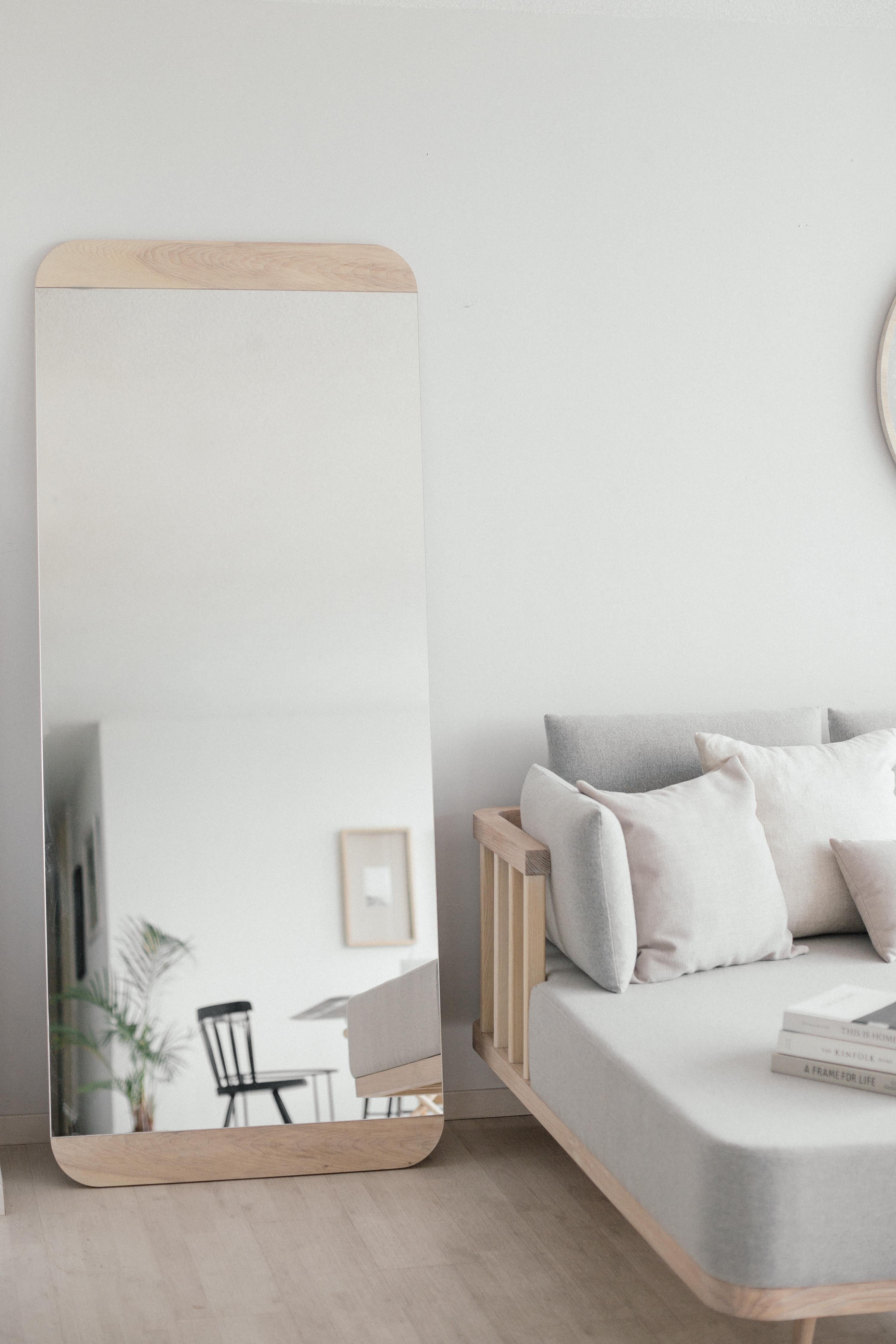 The Esteban Mirror seeks a subtle intention with its wood veneer stripes by framing the mirror with its round shape in the corners. It highlights the friendly personality of the piece and gives the perfect feeling in any room.  Production time: 6-8