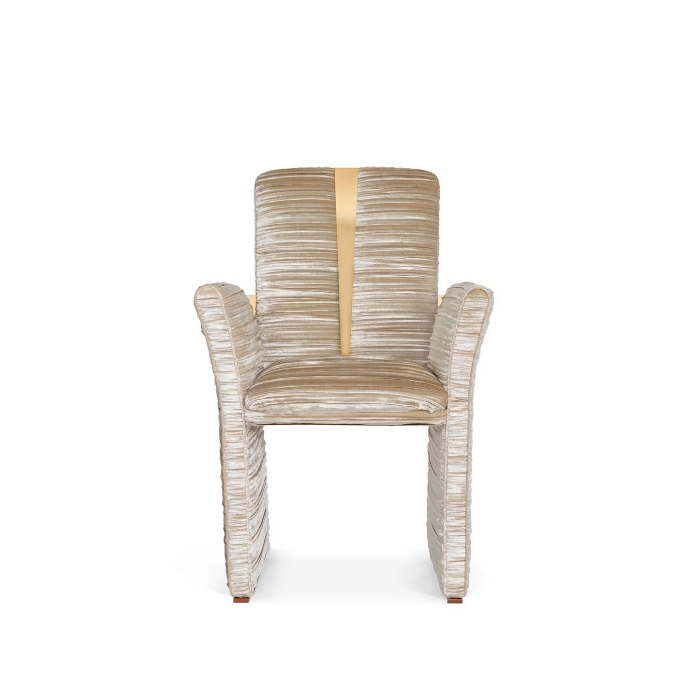 Perfectly tailored and draped as a delicate Kimono would wrap a woman, the Estelle dining chair brings statement design to any dining room. Upholster it in your favorite color to coordinate with the chair’s sleek brass details for a look that is
