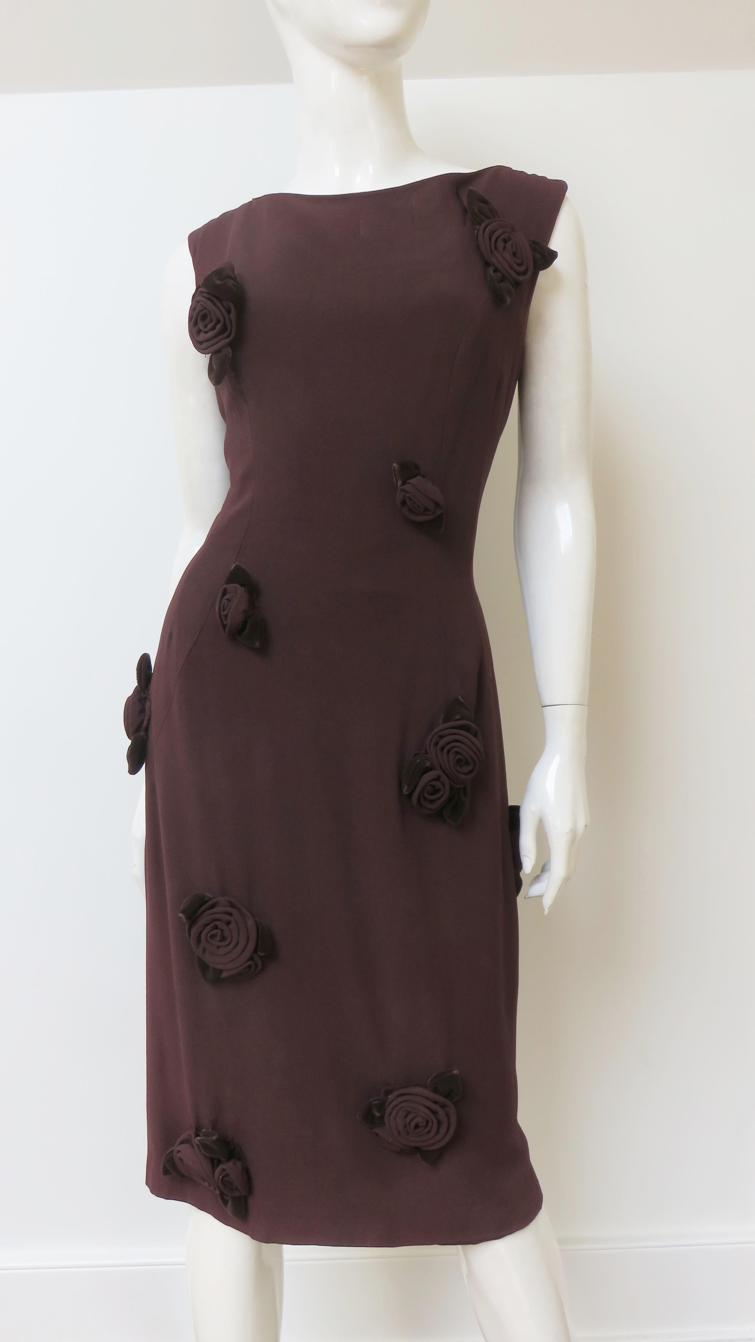 A fabulous chocolate brown dress by Louis Estevez covered in applique roses from Louis Estevez. It is semi fitted, sleeveless and covered in appliques of elaborately constructed roses comprised of matching fabric petals and velvet leaves. It is